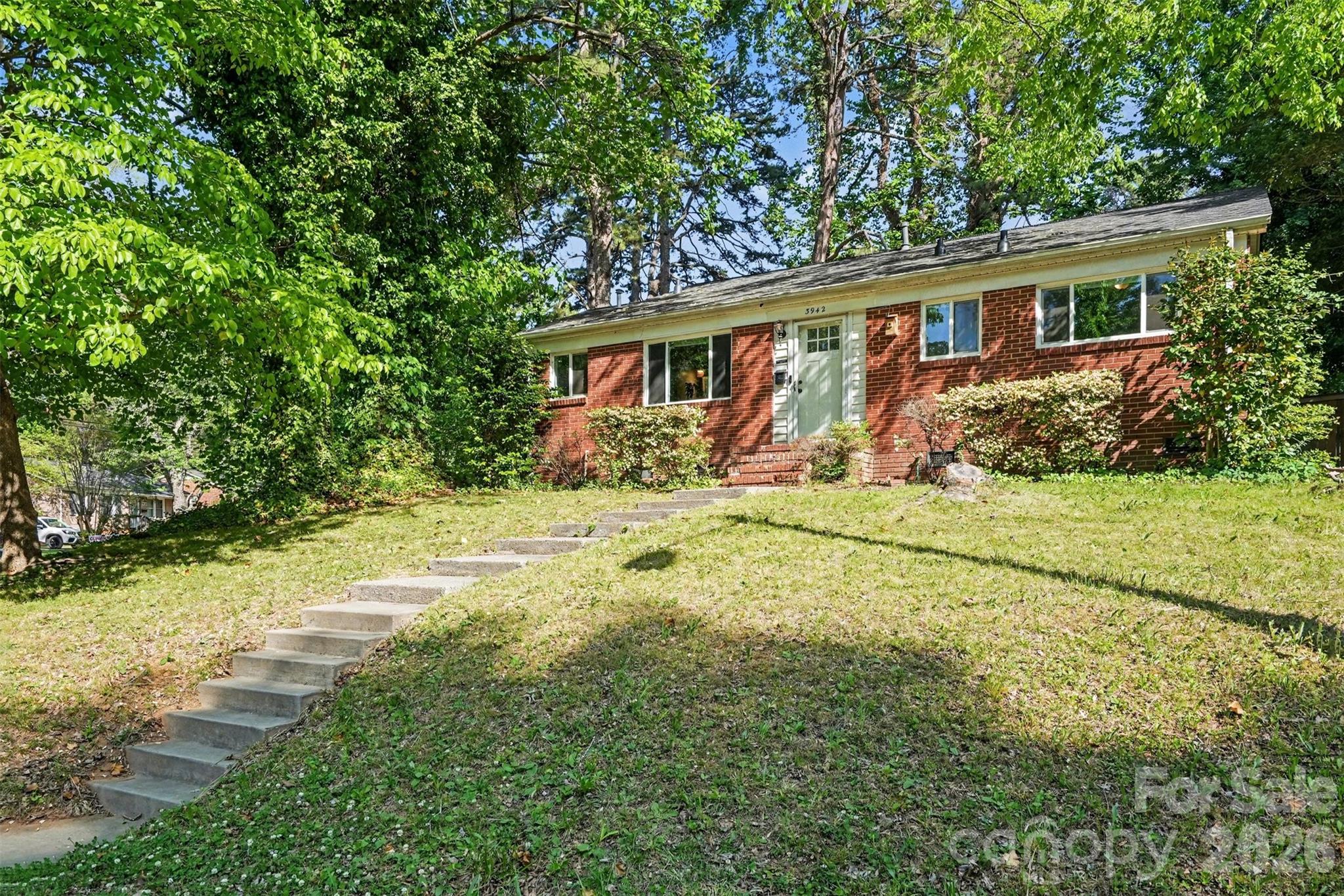 Located in the highly desirable Shamrock Hills neighborhood, this move-in-ready all-brick ranch sits on a spacious corner lot and is packed with upgrades buyers are searching for! Featuring beautiful hardwood flooring throughout with tile in the kitchen and bath, this home blends classic charm with modern updates. The renovated kitchen offers white cabinetry, granite countertops, and a mix of black and stainless steel appliances for a stylish, functional space.

Major system updates provide peace of mind, including new electrical and plumbing (2021), a whole-house water filtration system (2021), a tankless water heater (2021), new windows (2021), an HVAC system (2017), and a brand-new roof installed in 2024. Enjoy outdoor living with a backyard storage shed ideal for gardening tools, hobbies, or additional storage.

Conveniently located near Plaza Midwood, NoDa, Uptown Charlotte, dining, shopping, and entertainment, this beautifully updated ranch offers the perfect combination of location, character, and modern efficiency. Don’t miss your opportunity to own a turnkey home in one of Charlotte’s most sought-after areas—schedule your showing today!