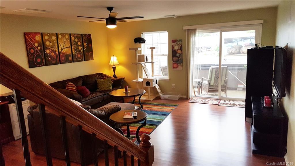 Beautiful end unit in sought-after Catawba Village!  Wood flooring on main, corian counters, tile back splash, cabinet pulls, wrought iron spindles on staircase, custom paint colors, surround sound, security system, 7-ft privacy fence for private patio, meticulously maintained.  Seller says hot tub can stay with acceptable offer!