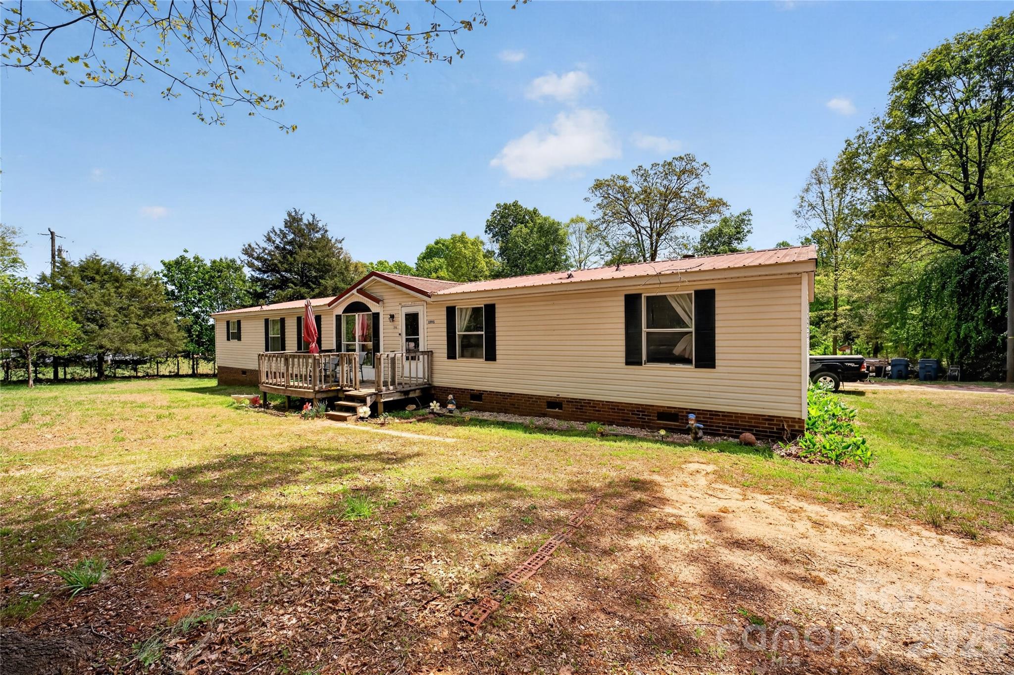 Spacious 3-bedroom, 3-bath manufactured home built in 2001, situated on 1.1 acres! With over 2,000 square feet, this home offers a functional layout with plenty of room to spread out. Enjoy the privacy and flexibility of a larger lot while still being conveniently located to nearby amenities. A large ramp at the rear of the home provides easy access. Whether you're looking for a primary residence or investment opportunity, this property has great potential. Don’t miss your chance to make it your own!