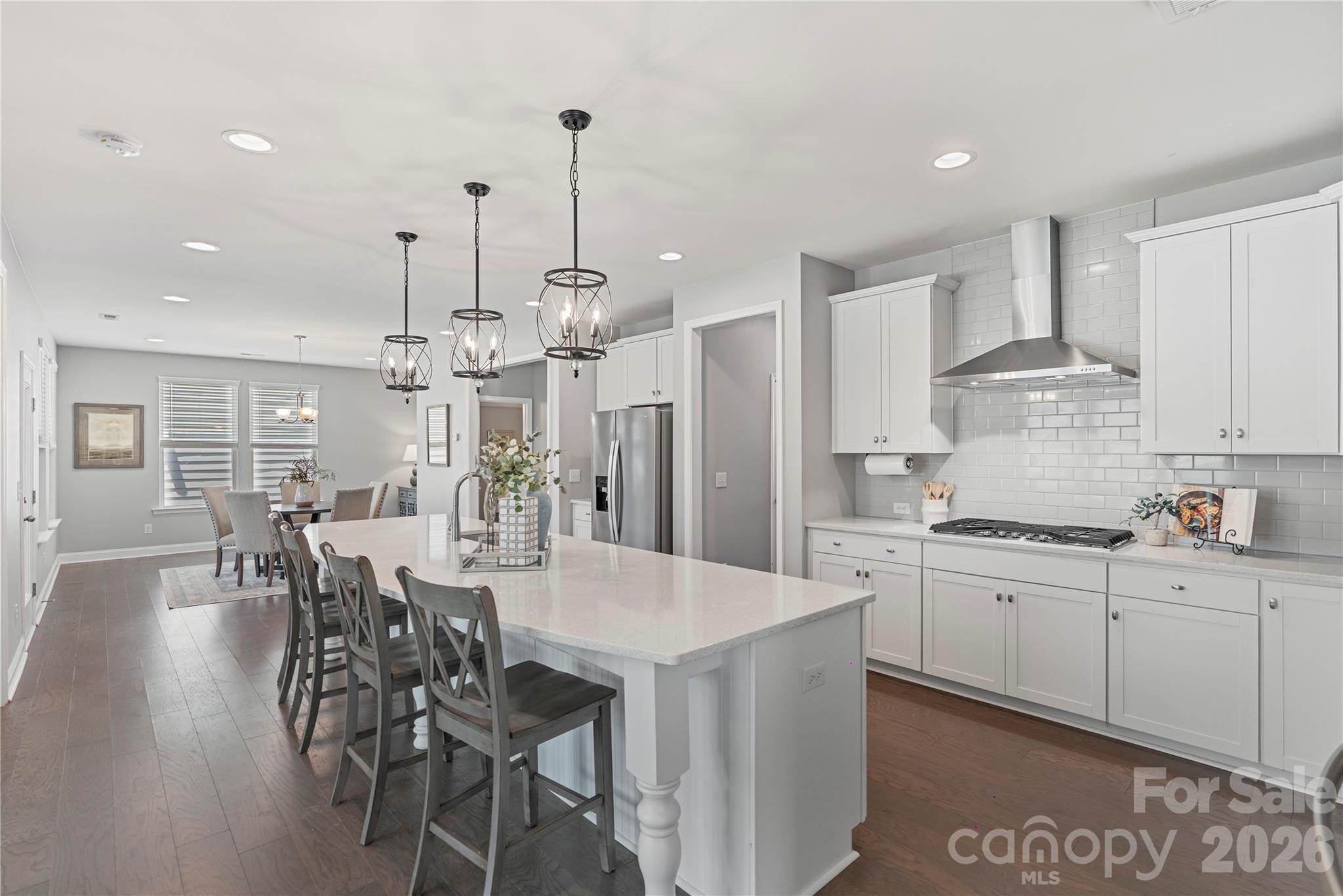 Spacious 5BR Home in Masons Bend with Guest Suite, Screened Porch & Resort-Style Amenities! 

Welcome to this move-in-ready 5-bedroom, 3.5-bath home in Fort Mill’s award-winning Masons Bend community. Built in 2021, this home offers an open-concept floor plan with neutral finishes, abundant natural light, and flexible living spaces throughout.

The main level features a private home office, formal dining room, and a main-level guest suite with full bath, ideal for visitors or multi-generational living. The gourmet kitchen includes a large quartz island, stainless steel appliances, walk-in pantry, and opens to the breakfast area and family room with a fireplace.

Enjoy outdoor living on the screened-in patio overlooking a flat, fenced backyard - perfect for play, pets, or a future pool.

Upstairs you’ll find a spacious loft, three secondary bedrooms, full bath, laundry room, and a luxurious primary suite with dual vanities, walk-in shower and walk-in closet.

Masons Bend amenities include two pools, fitness center, clubhouse, playground, walking trails, and direct access to the Catawba River. Zoned for top-rated Fort Mill schools and minutes to I-77, Ballantyne, Rock Hill, and Uptown Charlotte.

This home is a fantastic opportunity to own a 5 Bedroom home with exceptional value, in one of Fort Mill’s most desirable neighborhoods. Schedule your showing today!
