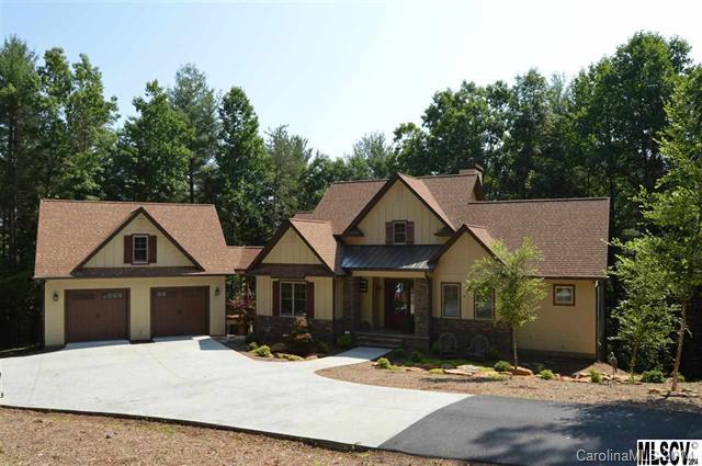 Gorgeous Craftsman Style Home On Private 4.12 Acre Lot. Nestled within gated, lakefront Harbor Ridge community, stunning home offers striking combination of rustic & modern details. Main lvl features GR w/cathedral ceilings, windows looking into the tree canopy & custom stone FP, kit w/granite counter-tops, glass tile back-splash, top-of-the-line appli, soft close cabinetry & pantry, office w/French-style doors & vaulted ceiling & mstr suite w/beamed vaulted ceiling, WIC, private deck.