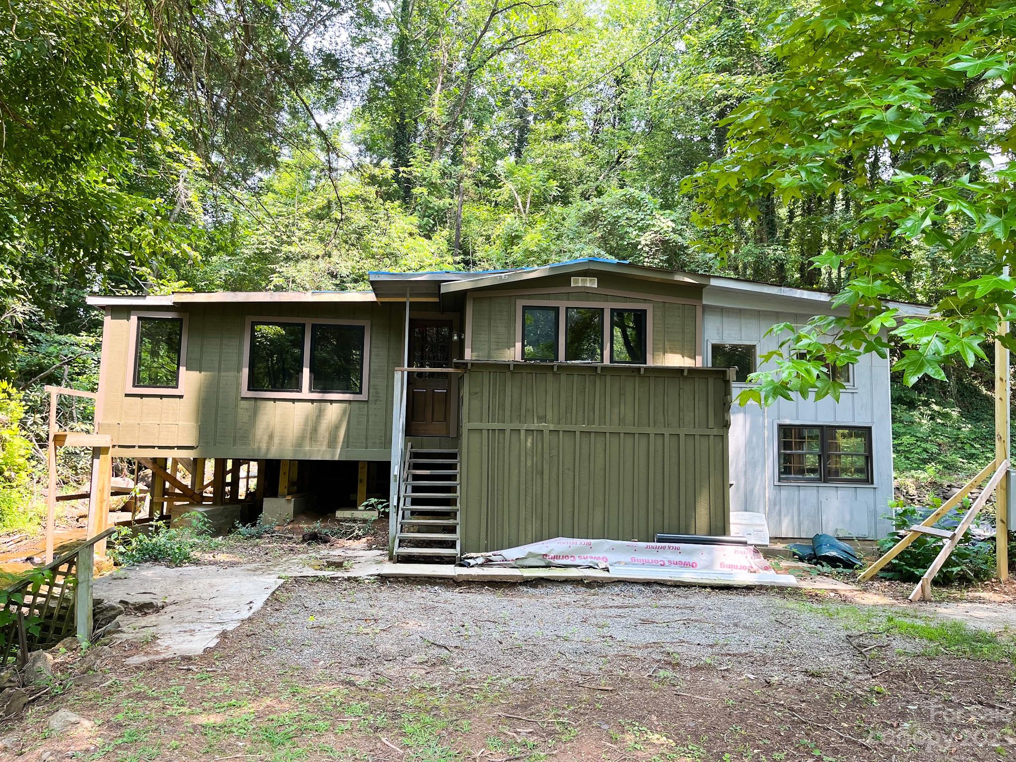 Incredible investment opportunity awaits on the tuck. Fixer upper duplex available with a small creek and waterfall on .45 acres. Sale includes parcel 7640-75-2898 with an additional 2.49 acres and incredible water front property just waiting for your fire pit and some great trout fishing. Studs are up for a 2 bed 1 bath apartment on one side and a 1 bed 1 bath apartment on the other. Would make an incredible AirBnb or rental. Less than a mile from Lowes and Wal Mart and 3 miles from WCU. Home being sold AS-IS as a project house.