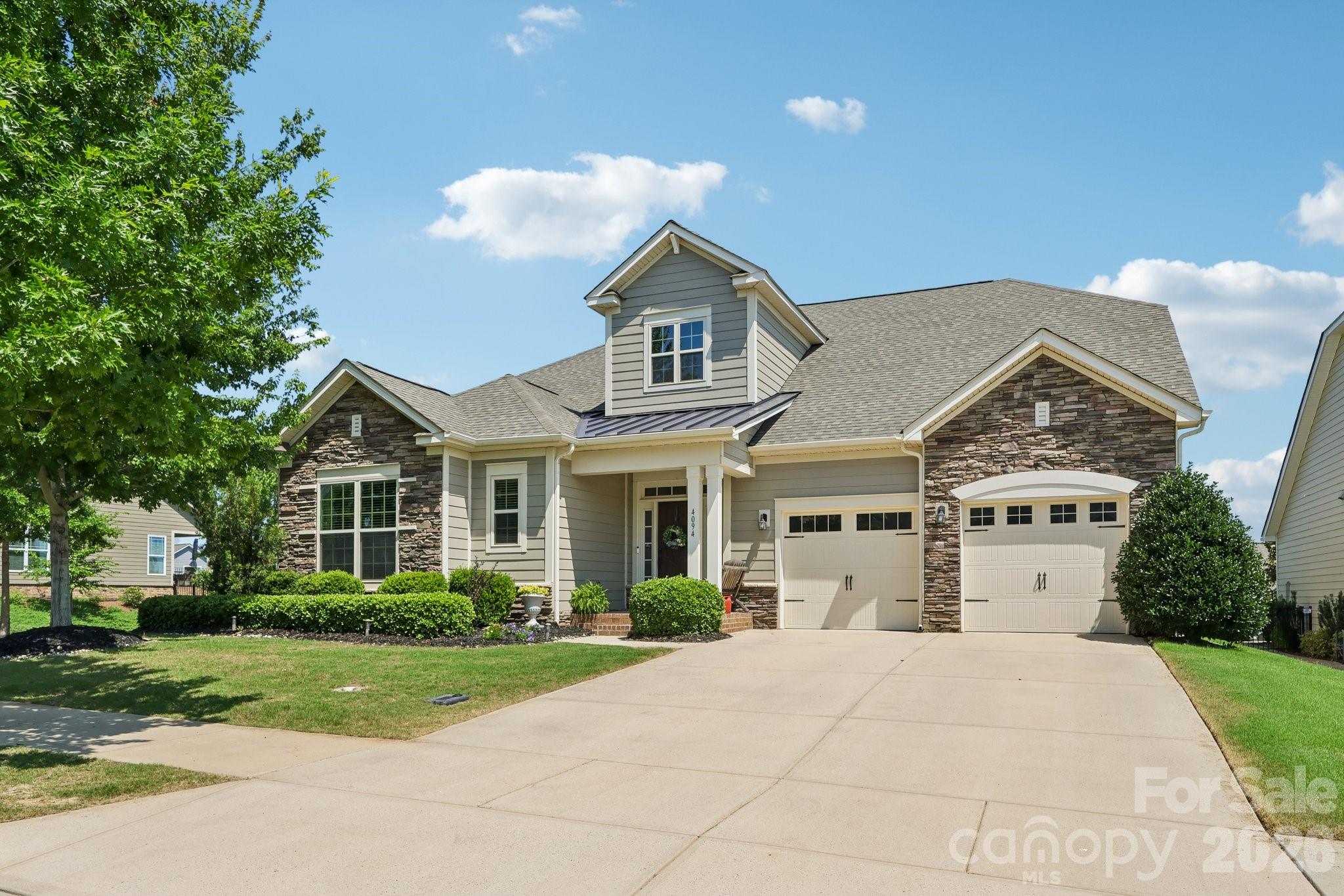 Luxury, Leisure, and Impeccable Craftsmanship in Millbridge
Discover exceptional comfort and resort style living in this beautifully designed 4 bedroom, 3 bath home situated on a beautifully landscaped corner lot. This home offers the added convenience of lawn maintenance included in your enhanced HOA fee. Perfect for those seeking a low maintenance lifestyle.
A welcoming two story foyer sets the tone for the bright, open layout. The chef’s kitchen is a standout feature, offering granite countertops, a double tiered island, gas cooktop, convection oven/microwave combo, custom walk in pantry with countertop space, cabinet pull outs, and a spacious breakfast area with a built in desk or coffee nook. The living room centers around a cozy gas log fireplace, while the dining room features an elegant tray ceiling. Multiple Wi Fi connected switches and a Nest thermostat add modern convenience throughout the home.
The main floor layout includes a luxurious primary suite with tray ceiling, oversized tiled shower, double vanity, and a custom walk in closet complete with built in dresser. A main level guest bedroom and full bath provide ideal flexibility for visitors or a private office setup. The large laundry room offers additional storage and functionality.
Upstairs, a spacious loft serves as the perfect flex space for media, lounging, or play. Two additional bedrooms, a full bath, and a dramatic 6 foot skylight create a bright and inviting upper level with plenty of room to spread out. Ample storage options ensure everything has its place.
Outdoor living is equally impressive. Enjoy a large extended patio ideal for grilling, relaxing, or entertaining, along with a full irrigation system to keep the yard looking its best. The corner lot provides added privacy and curb appeal.
Residents of Millbridge enjoy access to one of the most sought after amenity packages in the region. The community features a Community House with inviting common area and movie room, a junior Olympic pool, lazy river, fitness center with weight room and exercise studio, airnasium for court sports, a second pool complex with pickleball and tennis courts, multiple play grounds and pocket parks, and miles of scenic trails connecting to the Carolina Thread Trail. 
Located just minutes from historic Downtown Waxhaw, this home offers quick access to charming shops, dining, entertainment, and local conveniences
With its thoughtful layout, upgraded features, smart home touches, and unmatched community amenities, this home delivers the full resort lifestyle experience in one of Waxhaw’s most desirable neighborhoods.