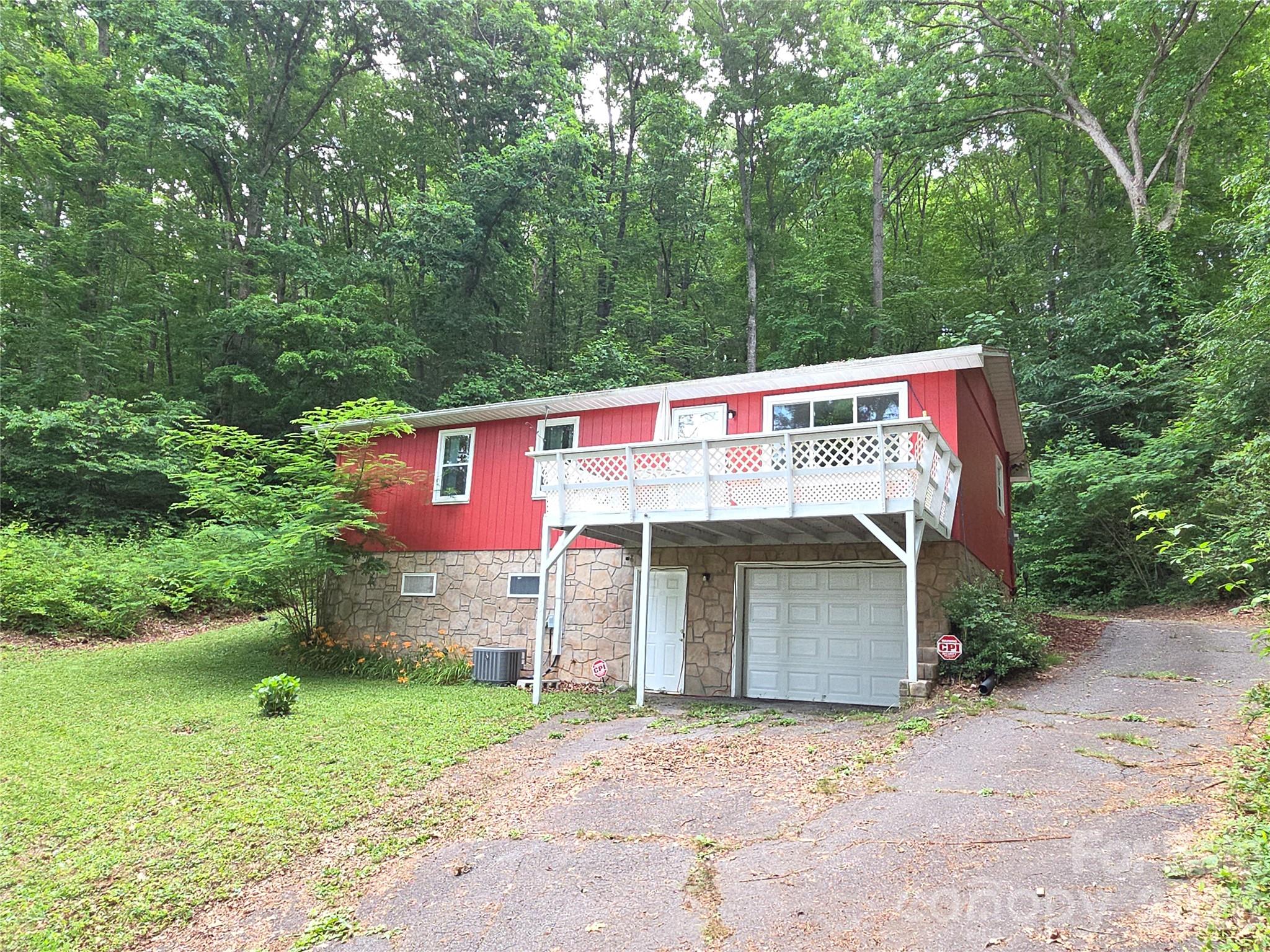 Ideally situated just minutes from Downtown Sylva and WNC University, this one-level home delivers convenience and potential. Inside, you’ll find 3 bedrooms, a bright family room with deck access, and a generous eat-in kitchen with modern updates. The unfinished basement—complete with interior access, abundant storage, and a 1-car garage—offers excellent expansion opportunities. Easy parking and a main-level entrance make everyday living effortless.