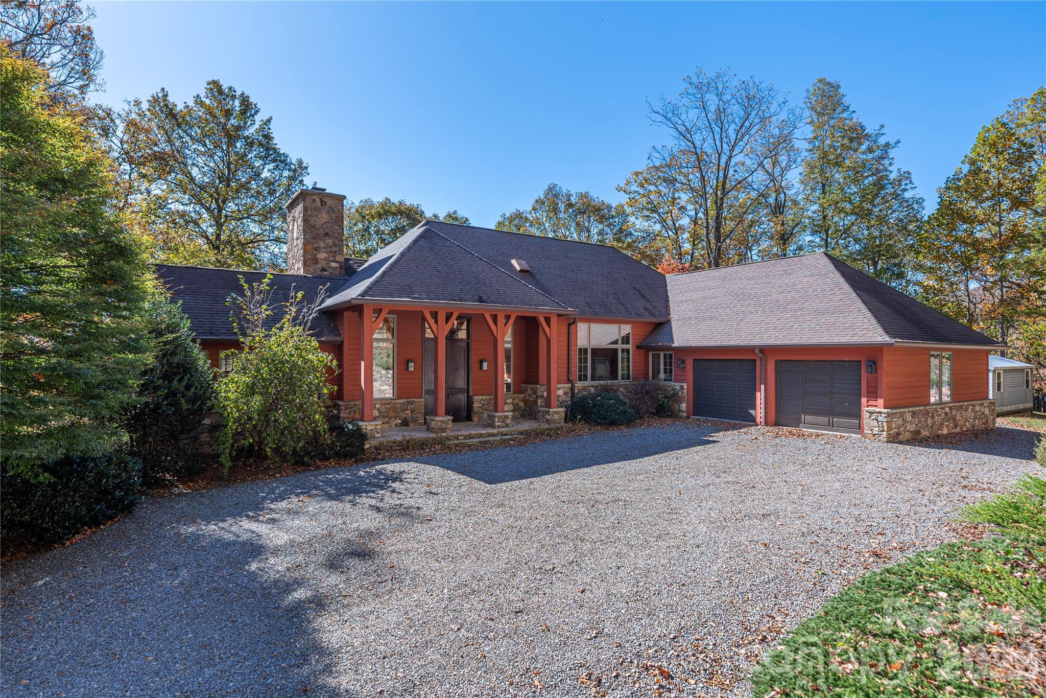 Set just outside Black Mountain, this custom-designed 4,200-square-foot, 3-bedroom, 3.5-bath residence blends modern luxury with the quiet majesty of Western North Carolina’s natural landscape. Resting on 238 acres of protected hardwood forest conservation land, the 3300’ elevation beneath the escarpment atop Dill Knob offers unmatched privacy, panoramic mountain views, and a deep connection to the surrounding wilderness. 
Designed by architect Jan Grierson and built by Joe Wheeler in conjunction with local artisans, the home showcases thoughtful craftsmanship throughout — from pocket doors and oak flooring to custom cherry cabinetry, wooden ceilings, and multiple fireplaces that create warmth and character. Expansive windows frame the mountains, while the landscaping integrates native plants, stonework, and curated outdoor spaces that shift beautifully with the seasons.
A charming 1-bedroom, 1-bath guest house provides additional living space with its own kitchen, wood stove, and generous living room — ideal for guests, multi-generational living, or creative retreat space.
Modern comforts are seamlessly woven into the property’s natural setting: A deep private well delivers pristine water, a whole-property generator ensures uninterrupted living, and high-speed internet keeps you connected without sacrificing serenity. This is a rare opportunity to experience true mountain living without compromise — a place where luxury, privacy, and nature coexist in perfect balance.