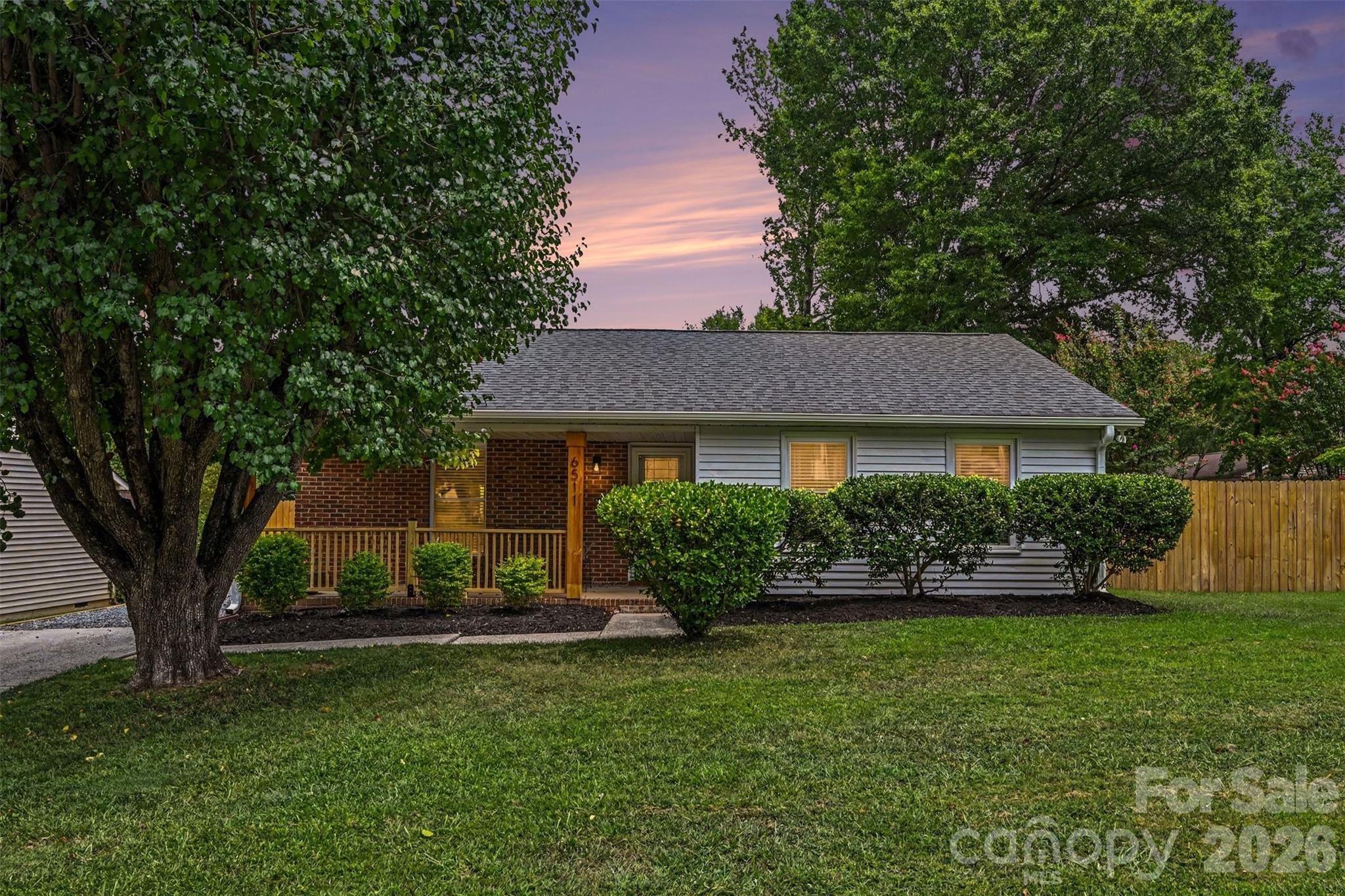Fully remodeled 2 bed, 2 bath tucked in a quiet neighborhood just minutes from Independence Blvd and an easy commute to Uptown. Every surface has been updated. LVP flooring and Craftsman molding run throughout. The kitchen features shaker-style cabinets, quartz countertops, and stainless steel appliances. The primary bedroom closet has custom built-ins, and the primary bath has a tiled shower with frameless glass. The second bath features a tub/shower combo with fully tiled walls. Outside, the home has been freshly painted with new gutters installed, and a brand-new deck and patio open to a fully fenced backyard with room to grill, entertain, or let the dog run. Move-in ready with nothing left to do but unpack.