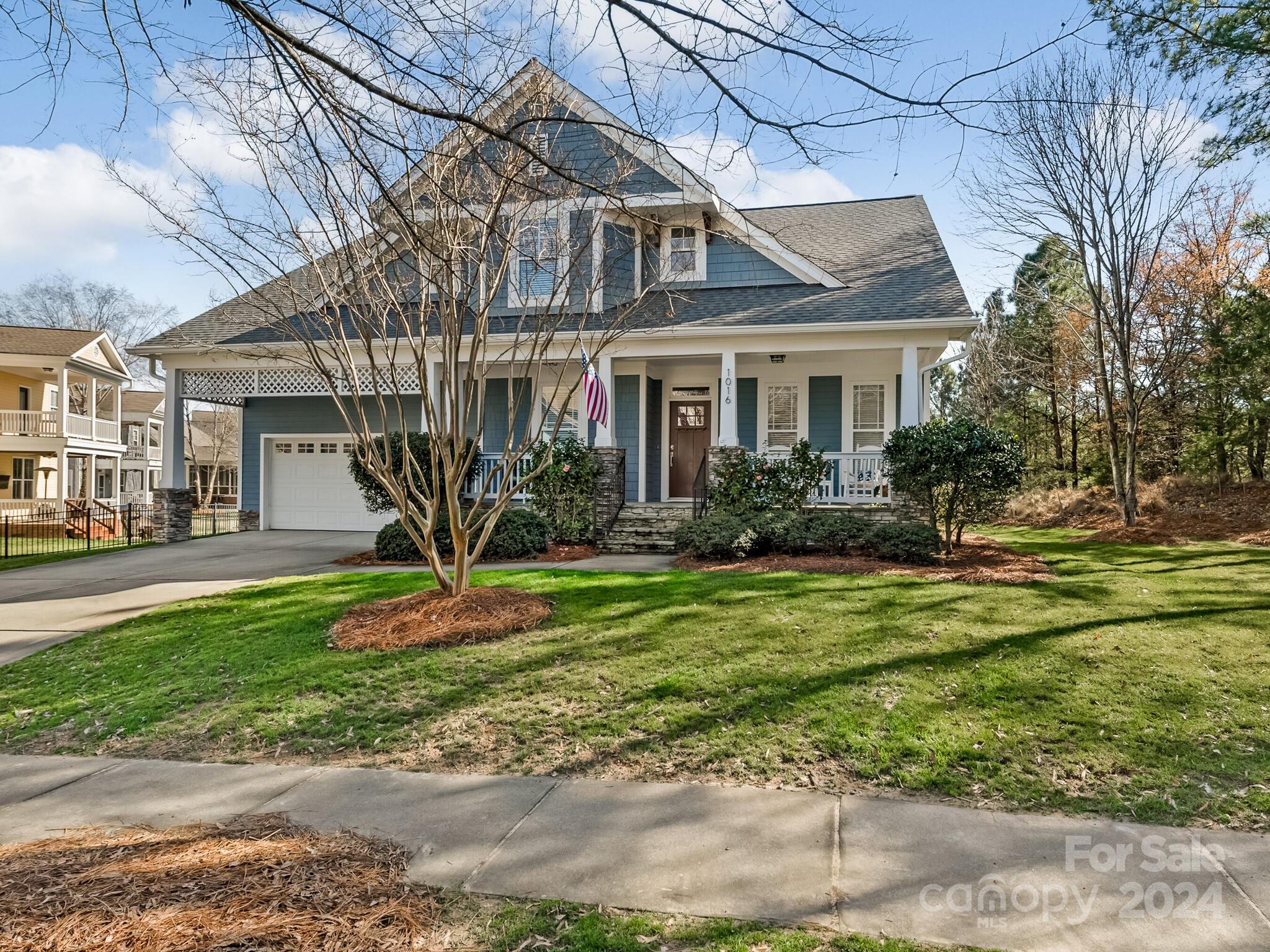 Enjoy the beautiful golf course & pond view from the deck or take a “sip of something” on the delightful front porch. This move-in ready house has been meticulously maintained with fresh paint on the exterior and interior, gleaming hardwood floors on the main level, carpet upstairs that looks like new & new Architectural shingle roof. The chef’s kitchen has leathered granite counters, custom backsplash & lovely wood cabinets, gas range with convection oven, & wine cooler has separate temp. settings for red/ white wine. The primary bedroom & bath are spacious on the main level having a custom glass enclosed shower,  garden tub two sink vanities and walk-in closet. Powder room has hand stenciled pattern on the walls. The level play area to the side of the terraced fenced yard is a plus. Four bedrooms & two Jack & Jill baths upstairs plus an office/bonus room. Lots of attic & garage storage. Amenities of Tega Cay include lake, clubhouse, golf, tennis, pool parks & trails. but no HOA fees!