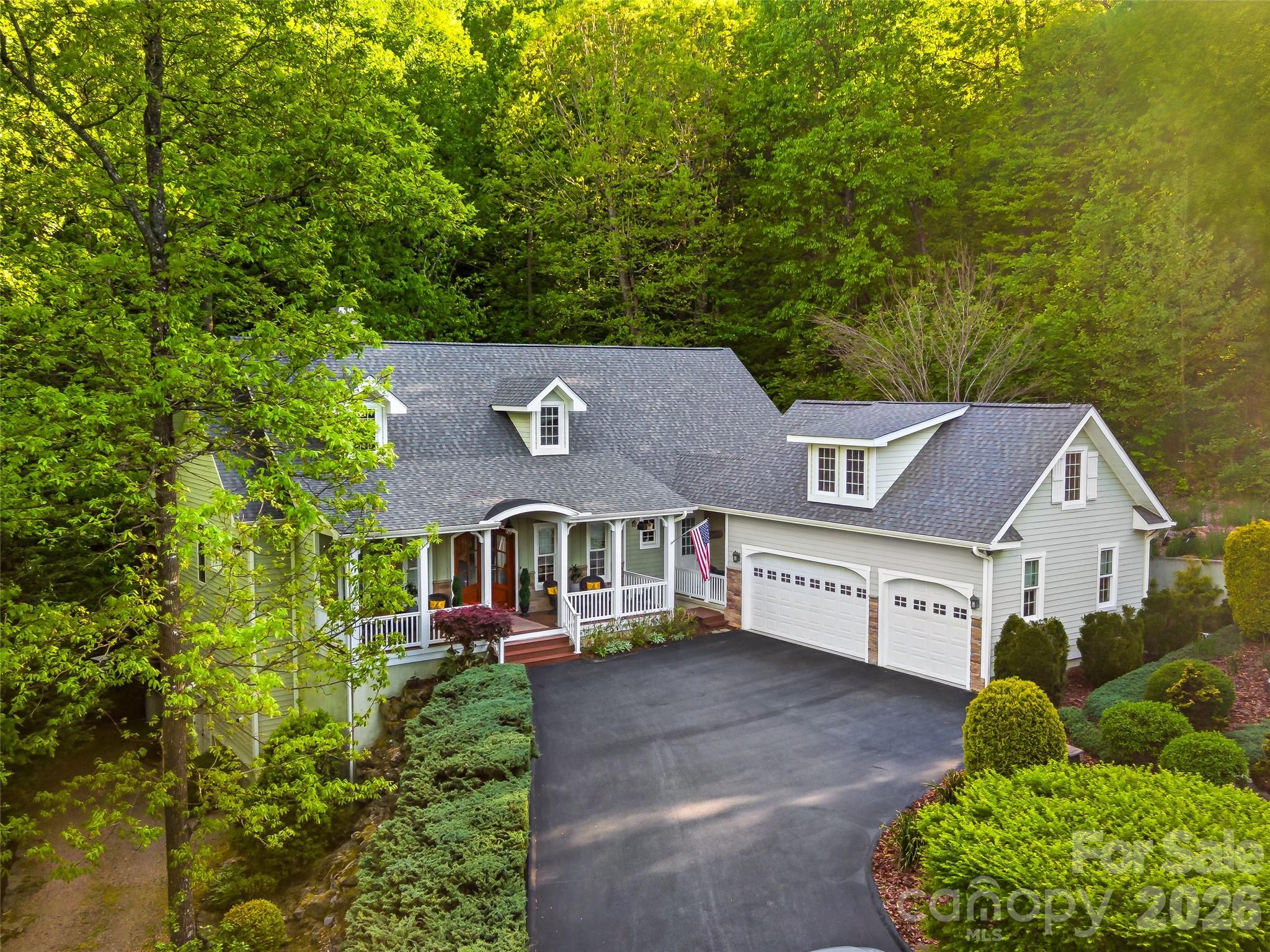 Welcome to 329 Kenmure Drive, located within the prestigious gates of Kenmure Country Club. Features include:
• One-level living
• Move-in ready
• Low-maintenance landscaping
• An abundance of storage
• New roof in October 2025
• Easy access, level driveway
• One HOA fee
• Exceptional craftmanship
• Solid wood 8-foot doors 
• Crown molding
• Quartzite countertops
• Whole home 10kW generator (3 years old)
• Expansive deck
• Beautiful stonework
• Workshop and additional storage in lower level (exterior entrance only)
Combining refined finishes, thoughtful amenities, and remarkable versatility, this exceptional Kenmure home offers an elevated mountain lifestyle in one of Flat Rock’s most desirable communities.