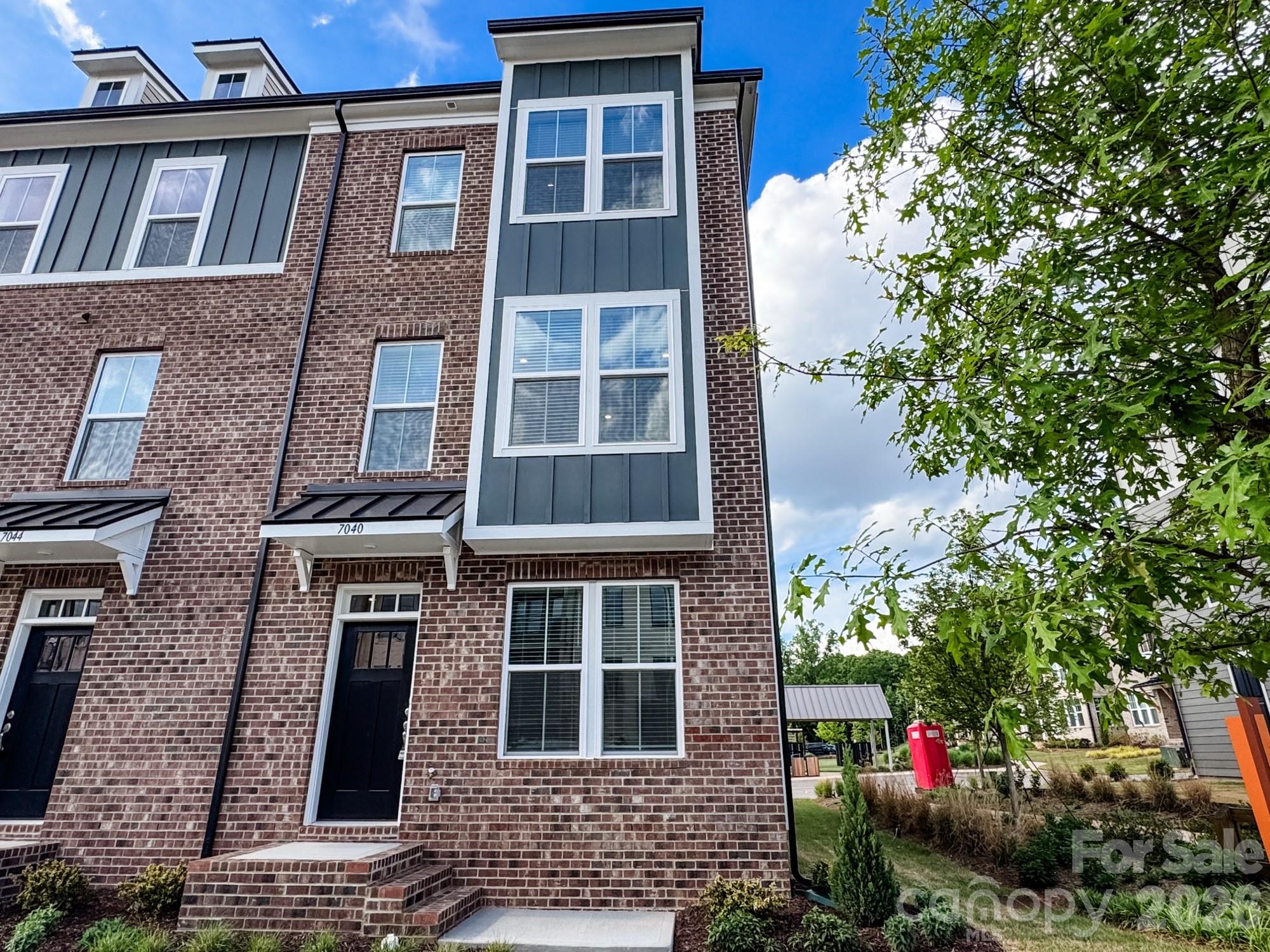 Welcome to The River District—a true master-planned community where lifestyle and location come together. 

This award-winning End Unit Landon three-story townhome offers a thoughtfully designed layout with a first-floor guest bedroom and full bath—perfect for visitors, multigenerational living, or a private home office.

The second level showcases a gourmet kitchen featuring quartz countertops, a built-in oven and microwave, electric cooktop, and soft-close cabinetry. The open-concept dining and living areas create an inviting space ideal for entertaining, while sliding glass doors lead to your private balcony that overlooks commons greens—perfect for relaxing or enjoying your morning coffee. 

Upstairs, you’ll find two beautiful owner’s retreats, each offering a bright, airy bedroom and a spa-inspired bath for ultimate comfort and privacy. A conveniently located laundry area completes the upper level. 

This home is filled with beautifully curated interior finishes, individually hand-selected by our professional design team, creating a cohesive and elevated aesthetic throughout.

Location is everything—and at The River District, you’re truly minutes from it all. Planned community amenities include a resort-style pool, clubhouse with fitness center, tennis and pickleball courts, parks, scenic trails, a working two-acre farm with an on-site farmer, and a riverfront amphitheater.

Experience vibrant, connected living in one of the area’s most exciting communities.