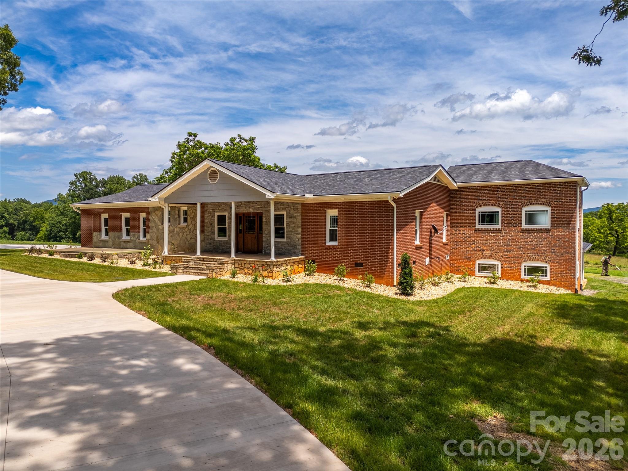 Completely remodeled and move-in ready, this beautiful brick ranch offers the perfect blend of country living, modern updates, and breathtaking mountain views. Situated on approximately 18.83 acres in desirable Rutherford County, this property features 13± acres of open grass fields and more than 5 acres of mature woods across a picturesque creek, creating an ideal setting for a farm, recreation, or private estate.

The home offers 1,828 square feet with 3 bedrooms, 2 bathrooms, and a walkout basement. Inside, you’ll find custom cabinetry, granite countertops, hardwood flooring throughout, and quality finishes that make this home feel brand new. Large windows capture the stunning long-range mountain views and allow natural light to fill the living spaces.

Outside, the possibilities are endless. The open fields are well-suited for horses, cattle, hay production, or a hobby farm, while the wooded acreage provides privacy, wildlife habitat, and opportunities for outdoor enjoyment. Multiple outbuildings and sheds offer excellent storage or agricultural use, and an additional older home on the property is currently being utilized for storage.

Conveniently located in a prime Rutherford County location, this exceptional property offers the space, views, and improvements that are increasingly difficult to find.

Whether you’re looking for a horse farm, cattle operation, mini-farm, or simply a peaceful country retreat with mountain views, this property checks all the boxes. A must-see!