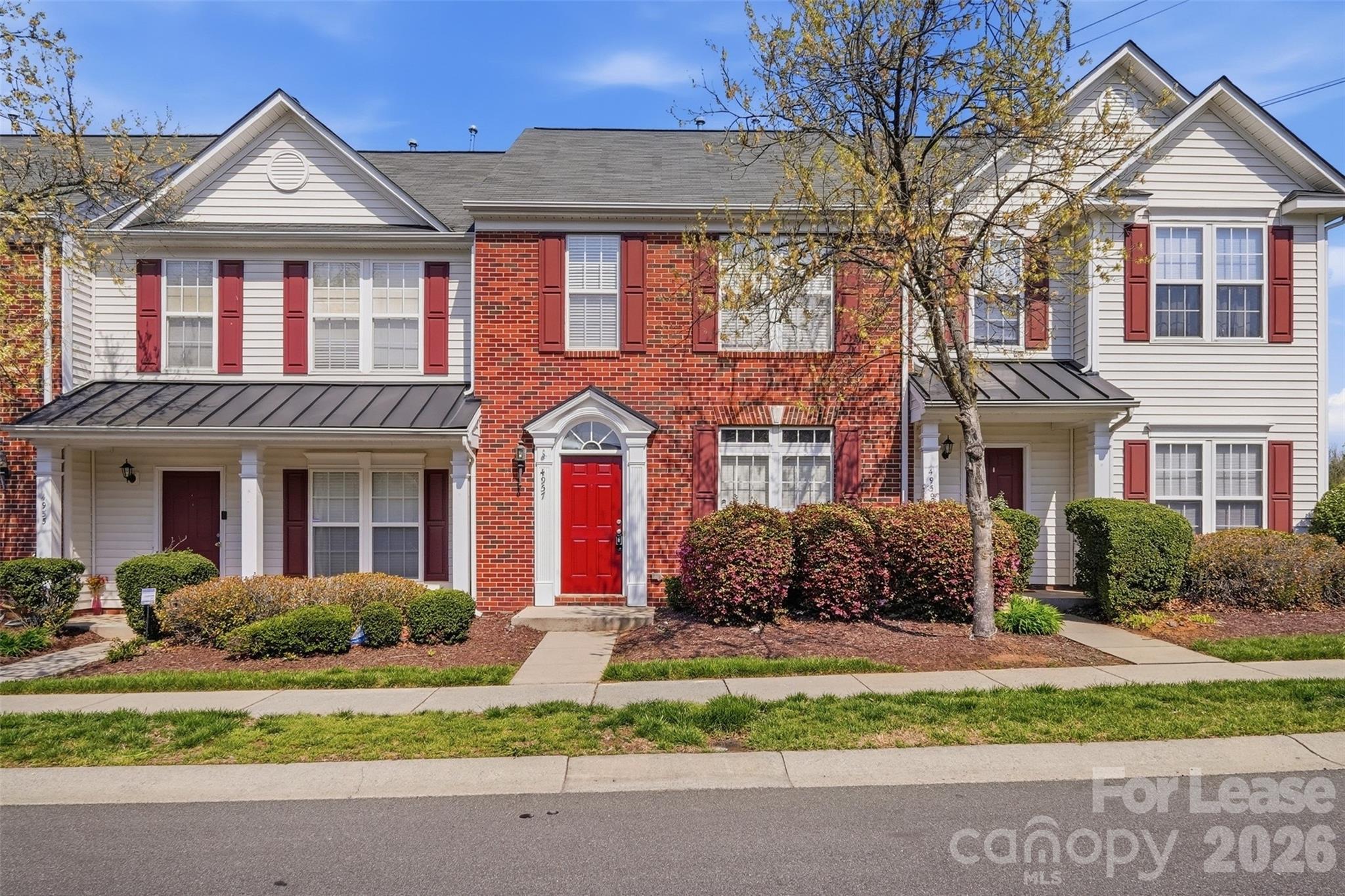 Welcome to this beautiful two-story townhome in the highly sought-after Farmington Ridge community! Featuring fresh paint and brand new laminate flooring throughout, this home is truly move-in ready. The spacious primary suite showcases elegant tray ceilings, a private en-suite bath, and a walk-in closet. Updated lighting fixtures and ceiling fans add style and comfort throughout the home. Step outside to a charming back patio that opens directly to the parking area—perfect for everyday convenience and entertaining. This one won’t last—schedule your private showing today!
