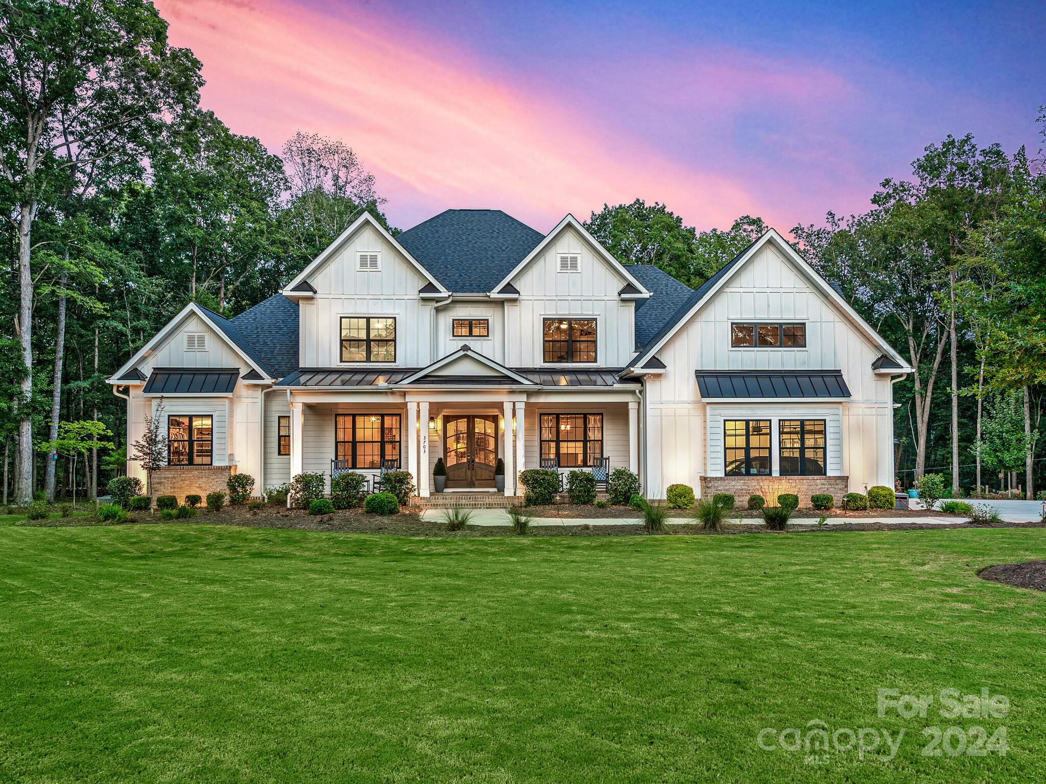 Stunning Custom Built Modern Farmhouse on 5 Private Acres in highly sought after Providence Road Estates. This home includes everything & is absolute perfection! Inviting open floor plan featuring high ceilings, exposed wood beams & custom millwork throughout. Main level primary suite boasts gorgeous wooded views, soaker tub & large custom closet. Massive screened porch with gas fireplace opens to family room via multi-stack sliding doors. Chef's dream kitchen with breakfast area, beverage center & scullery pantry. Main floor also includes guest bedroom & en-suite, drop zone with built-ins & laundry/office. Upstairs has 3 large bedrooms all with en-suites, rec room & huge exercise room. Backyard oasis features saltwater pool, hot tub, firepit, & outdoor kitchen/cabana. Fully fenced with private gate, 4-car garage & self-feeding chicken coop. Top rated Marvin Ridge schools & just minutes to historic Waxhaw, Blakeney & Ballantyne. Rare find with privacy, seclusion & optional HOA!