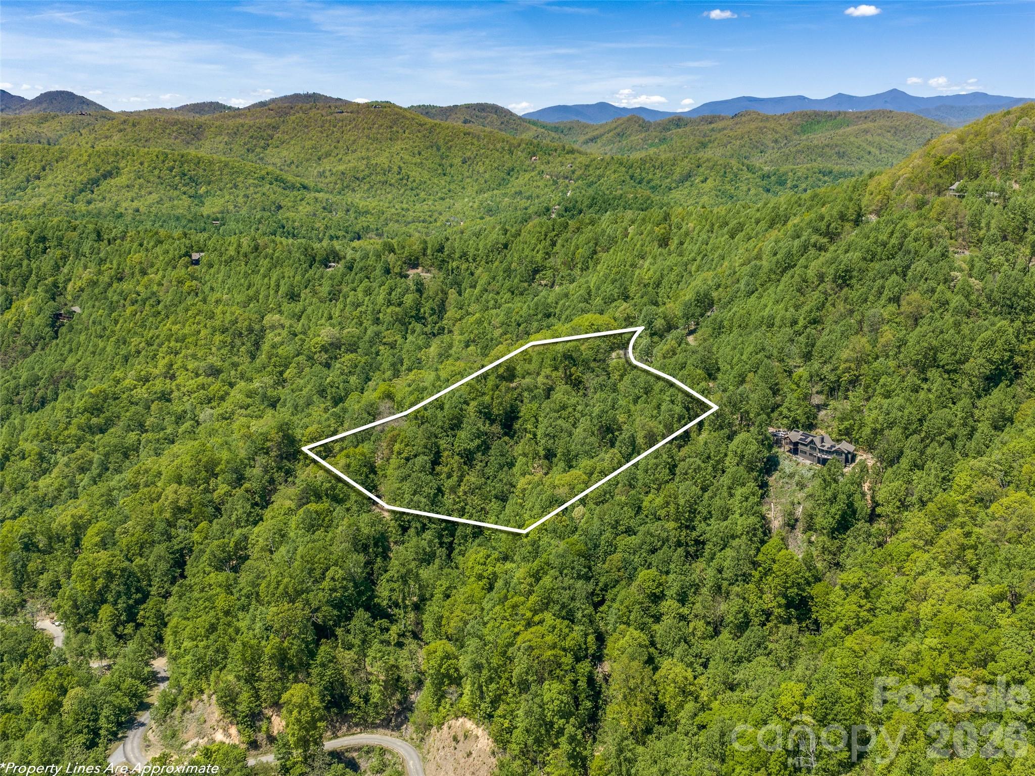 Exceptional 4.22-acre level homesite with breathtaking year-round mountain views! Tucked away at the end of a private cul-de-sac and protected on two sides by HOA common land, this rare property offers unmatched privacy. A level, roughed-in driveway leads to a large, flat building pad with gentle topography—ideal for creating your private mountain retreat while enjoying some of Creston’s most spectacular long-range views. Improvements already in place include a well and completed 3-bedroom soil scientist evaluation, helping streamline your building process. Surrounded by mature hardwoods and natural beauty, this homesite perfectly balances seclusion and convenience. Creston is one of Western North Carolina’s premier conservation-focused gated communities, featuring approximately 500 acres of protected community and conservation land, including hiking trails, waterfalls, parks, and the stunning Triple Falls Sanctuary. Residents enjoy paved roads, underground utilities, Spectrum high-speed internet, a mountaintop clubhouse, fitness center, dog park, and a welcoming mountain community atmosphere. Conveniently located — only 20 minutes to downtown Black Mountain and 30 minutes to Asheville and Lake Lure.  Don’t miss this extraordinary opportunity to build your mountain dream home!