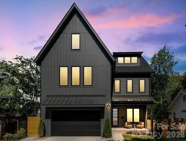 Wowza… What is NOT to LOVE?  This is the kind of house your friends will immediately want to hang out in. Tucked between NoDa, Plaza Midwood, Vila Heights, and Uptown, this newer build was designed for people who love to entertain, host, and occasionally make the group chat a little jealous.

The third floor is the ultimate party trick — a full entertaining space with extra cabinetry, full-size fridge, dishwasher, and access to a covered terrace with skyline views that absolutely hits at sunset. Movie nights, game days, cocktails before dinner at Optimist Hall… this space was made for all of it.

Downstairs, the kitchen brings the drama in the best way possible with a massive waterfall-edge island, double ovens, gas cooktop, KitchenAid appliances, slim shaker cabinetry, and gorgeous white oak floors throughout. The kitchen flows effortlessly into the living area and out to the screened porch with TimberTech composite decking, because every good gathering eventually ends up outside.

Every bedroom has its own en-suite bath, all finished with gorgeous tile work that feels more boutique hotel than builder-grade. There’s also a practical drop zone for backpacks, gym bags, dog leashes, Amazon boxes, and all the stuff real life comes with. And unlike so many newer homes, this one still gives you a large fenced yard with room for dogs, gardening, cornhole tournaments, or future pool dreams.  With this much space this is more than likely your “Forever Home”.   

Then come the upgrades you may not notice right away… but your dad definitely will. Encapsulated crawlspace, foam-insulated attic, tankless water heater with recirculating pump, EV charger, hot/cold garage hose bibs, and thoughtful energy-efficient features throughout that make this home not just beautiful, but smart and comfortable too.

Stylish without trying too hard, loaded with quality upgrades, and close to some of Charlotte’s best restaurants, breweries, coffee shops, and nightlife — this is Charlotte living done very, very well.