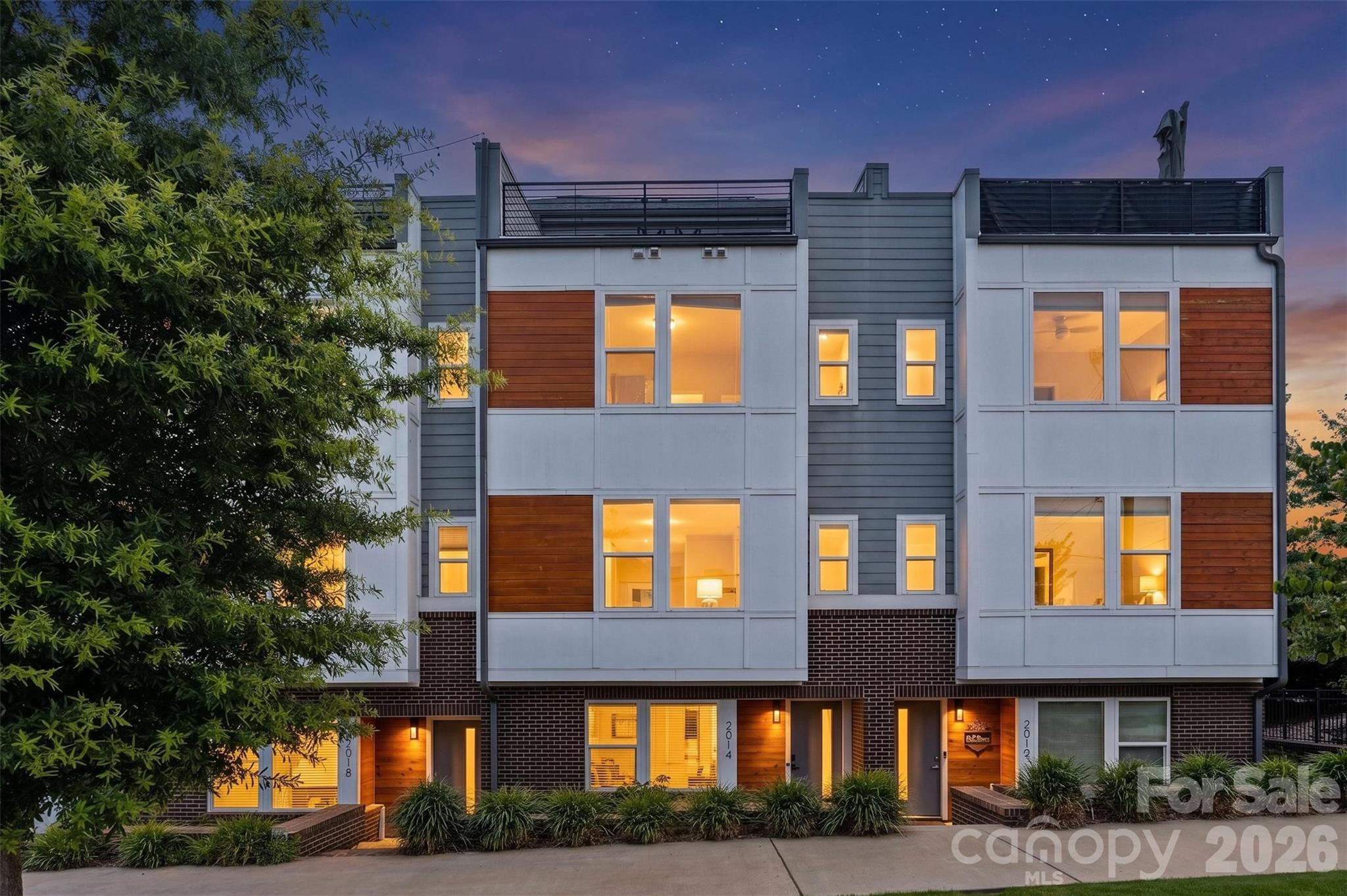 Welcome to 2014 Bryant Park Drive, a stunning modern townhome in the sought-after Bryant Park Terraces community, offering the perfect blend of luxury, space, and convenience just minutes from Uptown Charlotte and South End.

Spanning four thoughtfully designed levels, this 4-bedroom, 3 full bath, 2 half bath residence features an open-concept floor plan with elevated finishes throughout. The main living level is filled with natural light and showcases a chef-inspired kitchen complete with quartz countertops, stainless steel appliances, modern cabinetry, and a spacious island that seamlessly connects to the dining and living areas. Step outside to your private terrace, ideal for morning coffee or evening relaxation.

The upper levels provide ample space for both everyday living and entertaining. The spacious primary suite offers a spa-like bathroom and generous walk-in closet, while additional bedrooms and full baths provide flexibility for guests, family members, or dedicated home office space. A versatile loft area and rooftop terrace create the ultimate retreat for entertaining, relaxing, or enjoying views of the Charlotte skyline.

Additional features include a two-car rear-entry garage, energy-efficient systems, stylish brick and hardboard exterior, and low-maintenance living. Residents enjoy community amenities such as sidewalks, street lighting, and a dog park, creating an inviting urban neighborhood atmosphere.

Conveniently located near I-77, Bank of America Stadium, Charlotte Douglas International Airport, and some of Charlotte's best restaurants, breweries, shopping, and entertainment, this home offers exceptional access to everything the city has to offer.

Experience modern city living at its finest in Bryant Park Terraces. Schedule your private showing today.
