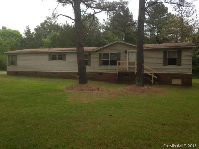 Large doublewide mobile home situated on a 1.50 acre lot.  4 bedroom 2 bath split bedroom floor plan. Kitchen opens into the family room with a wood burning fireplace.  Master bedroom has a large sitting area that can also be used as an office.  This home also has a separate den and laundry room.  Closets galore! This is a Fannie Mae property.
