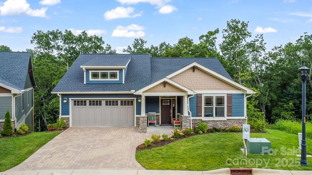 Community Model Home, MOVE IN READY, This newly constructed Craftsman home offers low-maintenance living in a gated mountain community, just minutes from the Historic Biltmore Estate and Biltmore Park. Main-level living features, owners suite, guest bedroom or den/office, laundry, kitchen and great room, vaulted ceilings, hardwood floors, quartz countertops, and a gas fireplace. Energy-efficient upgrades include multi-zone HVAC and a tankless water heater. The lower level adds a rec room, bedrooms, and full bath. Enjoy two decks with wooded views.
HOA-provided lawn care, clubhouse, pool, fitness center, and walking trails make life easy. With city utilities, county-only taxes, and timeless finishes, this home blends convenience with privacy. Home was listed in the MLS well before Construction actually began.  Also, Listed for rent MLS #4319513