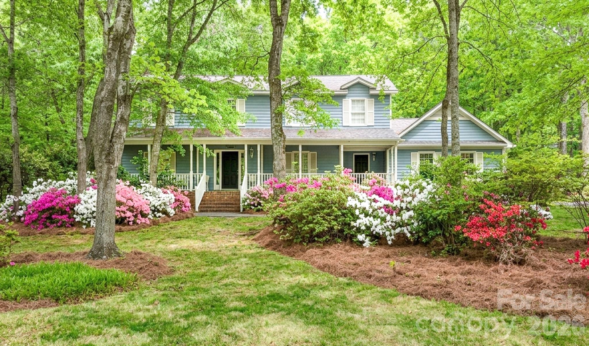 Experience the quiet charm of the Wood Forest neighborhood in this inviting home situated on a lush 0.6-acre lot. The massive front porch serves as the perfect introduction to a home built for both relaxation and easy entertaining. Inside, you will find a thoughtful floor plan featuring a family room complete with a fireplace and built-ins, offering a cozy and functional heart to the home. The kitchen comes equipped with a wall oven, sleek quartz countertops, and a cozy breakfast area. The main level offers great flexibility, including a formal dining room and a living room that transitions perfectly into a home office. Upstairs, the four bedrooms are generously sized and offer plenty of space for everyone. Step outside to the rear deck to enjoy your private wooded backyard, or take advantage of the side-load two-car garage that includes a dedicated storage area. With the added benefit of no city taxes and all major appliances included, this property is as practical as it is picturesque.