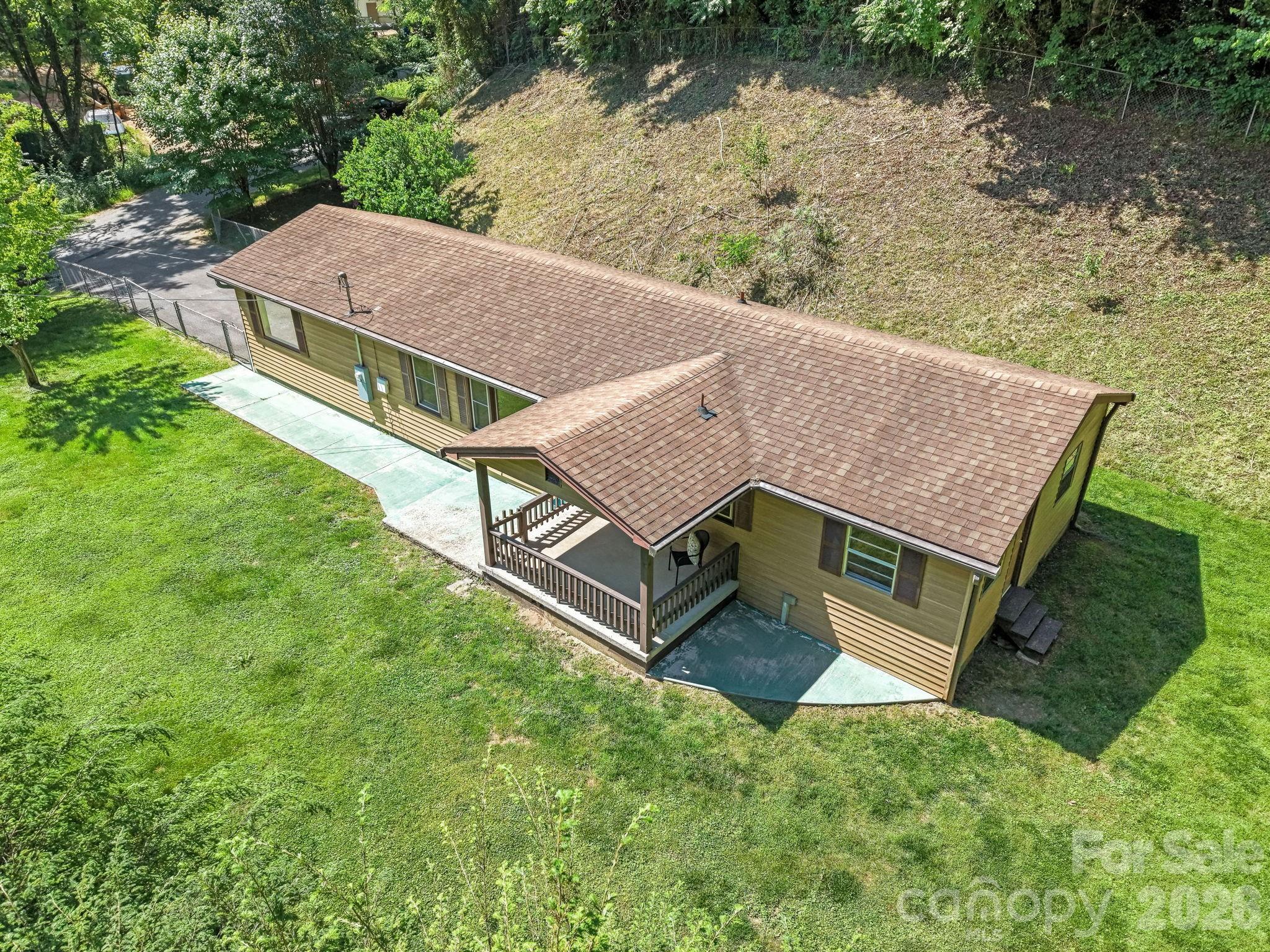 Sylva - Don't miss this affordable 3 bedroom house close to town! Featuring one-level living, attached carport, and a large, flat fenced-in yard. Easy paved access (only 1 mile from Harris Regional Hospital) and no restrictions. Call for your showing today!