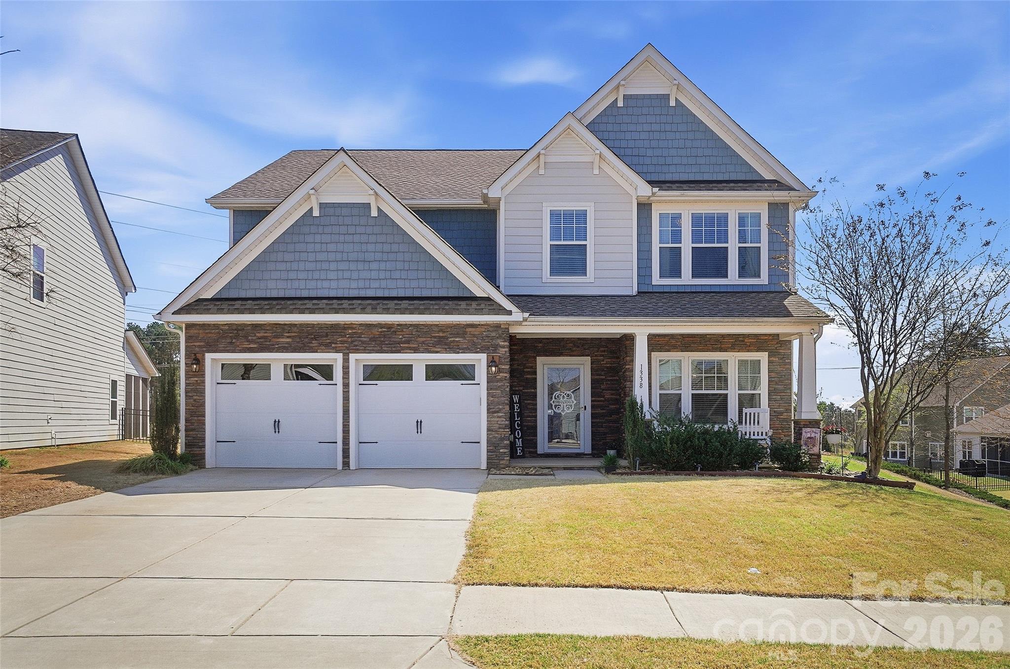Welcome to your dream home in the sought-after, gated community of Hands Mill on Lake Wylie! This stunning residence showcases an open-concept floor plan filled with custom finishes, including beautiful flooring, rich moldings, built-in cabinetry, barn doors, and elegant wainscoting. The heart of the home is the custom-designed kitchen, featuring stainless steel appliances, quartzite countertops, an oversized center island with ample seating, a spacious pantry, and a bright dining area—perfect for everyday living and entertaining. The inviting great room is filled with natural light and offers a double-sided fireplace that seamlessly connects to a cozy den. A formal dining room with detailed wainscoting provides the perfect setting for both elegant dinners and casual gatherings. Upstairs, you’ll find three generously sized secondary bedrooms, a large bonus room, and a luxurious primary suite complete with a sitting area and spa-like bath. Enjoy outdoor living at its finest—relax on the covered porch, host gatherings on the paver patio, or take advantage of the exceptional community amenities, including a resort-style pool, clubhouse, and fitness center. RV, kayak, and boat dry storage are also available for lease( subject to availability), making it easy to embrace the Lake Wylie lifestyle. Sc Taxes and sough after Clover schools.  This home truly has it all—comfort, style, and access to premier community features!