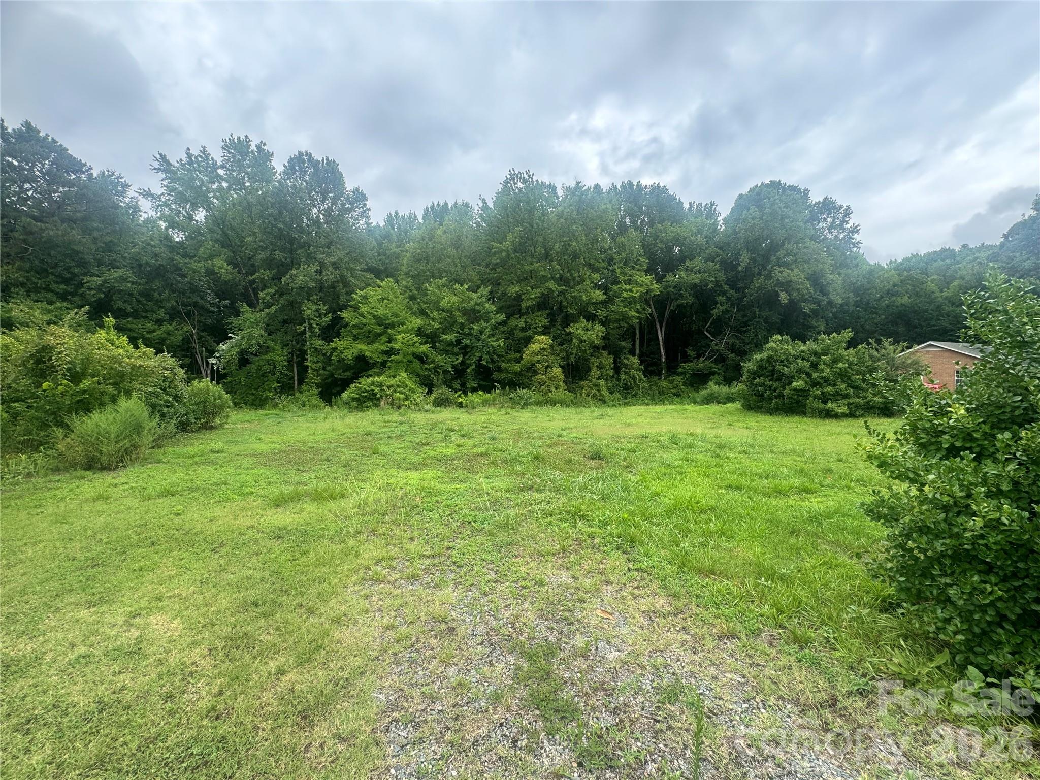 Build your next project on this 1.078-acre homesite in one of Charlotte's rapidly developing west-side neighborhoods. Public water and sewer are available, with potential for duplex construction (buyer to verify zoning and permitted uses). Conveniently located just minutes from Uptown, Charlotte Douglas International Airport, major interstates, shopping, dining, and the U.S. National Whitewater Center. Excellent opportunity for builders, investors, or developers.