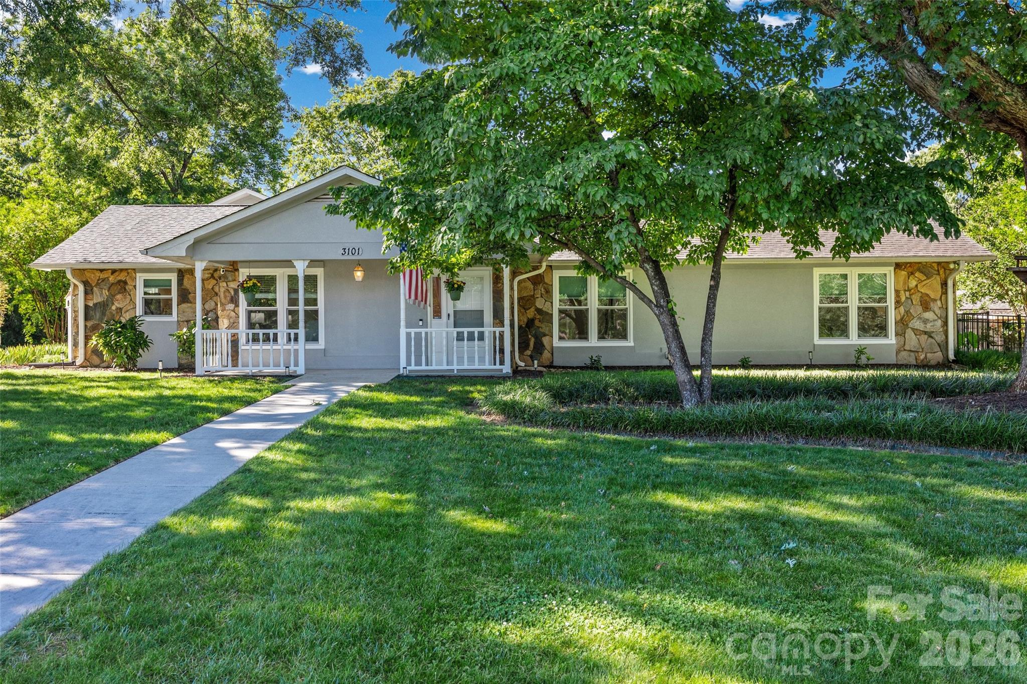 A rare South Charlotte jewel in East Providence Estates—an established community where homes seldom come to market. This beautifully maintained ranch sits well off McKee Road along an impressive, extended driveway with a circular turnaround, creating exceptional curb appeal. Inside, every room enjoys a view. The bright kitchen, cozy yet defined living and dining areas, and thoughtful layout offer both everyday comfort and effortless entertaining. The spacious primary suite features two separate closets, while the secondary bedrooms are generously sized. A separate living quarters/flex space provides valuable versatility for today’s lifestyle needs. Perfectly positioned near top-rated schools, shopping, dining, fitness options including Colonel Francis Beatty Park, I-485, and the Waverly/Rea Farms corridor, this home delivers the convenience buyers seek in one of Charlotte’s most desirable locations. It lives like a private retreat. Step outside to your own backyard oasis—an expansive, tree-lined lot with room to relax, garden, or play. The stunning in-ground saltwater pool with integrated hot tub is surrounded by multiple entertainment zones, including a covered porch/gazebo and a large patio ideal for gatherings. A secondary driveway leads to the detached oversized 2-car garage with epoxy flooring and storage cabinetry. The property also includes a 225-sq-ft well house/shed, perfect for storage or workshop use. The home is connected to city water while benefiting from a private well for irrigation and a septic system—offering long-term convenience and lower utility costs. With timeless curb appeal, exceptional privacy, flexible interior spaces, and resort-style outdoor living, this is truly a one-of-a-kind opportunity in one of Charlotte’s most coveted low-density neighborhoods with large lots, that preserve open space and neighborhood character. Non-HOA.  A genuine jewel and true pride in ownership—you don’t want to miss it.