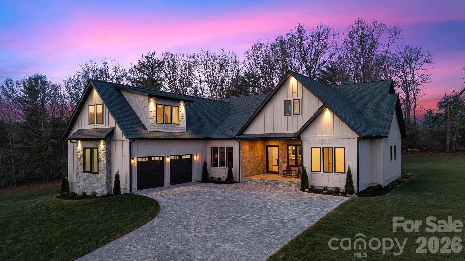 Experience luxury mountain living in this custom-designed home set on a private, nearly 1-acre lot (0.85 acres) with breathtaking mountain views from nearly every window.

This fully finished home was thoughtfully designed with high-end materials and timeless style.

The interior features wide-plank white oak hardwood floors, custom cabinetry throughout, and Restoration Hardware lighting. The living room offers vaulted ceilings with exposed beams and a wood-burning fireplace with a gas start, creating a warm mountain-modern feel.

The chef’s kitchen features Taj Mahal natural stone countertops with a full slab backsplash, premium professional Bosch appliances, and a spacious butler’s pantry with custom cabinetry and plenty of storage.

A beautiful office/library with custom built-ins provides the perfect space for work or reading.

Every bedroom is designed as a private suite with its own full bathroom and walk-in closet. 

Master bedroom features heated marble floors and a stunning custom walk-in closet. All bathrooms are finished with Italian marble tile and marble countertops.

The spacious laundry room features heated floors, generous workspace, and mountain views from the windows.
Outdoor living includes a front porch with beautiful mountain views, a private backyard, a screened porch, and a dedicated grilling area for entertaining.

Additional features include:

• Whole-home generator
• Commercial-grade Ubiquiti internet system
• Custom iron front door
• Central vacuum system
• Paver driveway

A rare opportunity to own a completely finished custom mountain home with luxury finishes, privacy, and spectacular views.