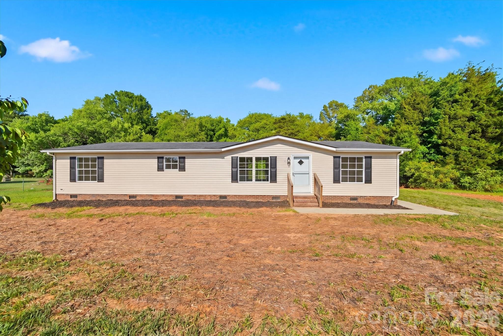 Welcome to this beautifully updated 3-bedroom, 2-bath home offering over 1,500 square feet of stylish living space on a spacious half-acre lot. Completely renovated, this move-in-ready home features a new architectural shingle roof, updated flooring, fresh paint, modern fixtures, and a stunning kitchen with white shaker cabinets, granite countertops, and stainless steel appliances.

Enjoy outdoor living with a large rear deck overlooking the fully fenced backyard- perfect for entertaining, pets, or relaxing evenings at home.

Offering the perfect balance of peaceful country living and everyday convenience, this property is ideally located near Statesville, Taylorsville, and major highways for an easy commute.

Don’t miss your opportunity to own this beautifully renovated home with modern updates, outdoor space, and a prime location! Schedule your showing today!