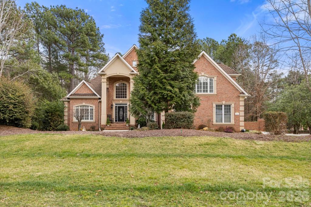 Refined luxury meets resort-style living in this exceptional five-bedroom, five-and-a-half-bath residence in the highly sought-after Huntington Farms community. Privately positioned on a wooded cul-de-sac lot, this expansive estate offers more than 5,900 square feet of thoughtfully curated living space, including a finished basement and a stunning in-ground pool with spa.
The main level showcases a spacious primary suite with tray ceiling and a beautifully appointed ensuite bath, along with a private guest suite—ideal for multigenerational living or long-term guests. A dedicated office, formal dining room, and elegant great room create a sophisticated yet inviting atmosphere, highlighted by hardwood floors, crown molding, tray ceilings, custom wainscoting, and a gas fireplace. The well-appointed kitchen blends function and style with granite countertops, double wall ovens, an electric cooktop, tile backsplash, and abundant cabinetry, flowing seamlessly into the main living areas for effortless entertaining. Plantation shutters throughout much of the home add timeless architectural character.
Upstairs, additional guest bedrooms and full baths accompany an expansive, flexible bonus space perfect for a media room, fitness studio, or playroom. The finished lower level further extends the home’s versatility, offering a private guest retreat with bedroom and full bath, generous recreation space, a second gas fireplace, and extensive storage.
Outdoor living is equally impressive. A spacious main-level deck constructed with low-maintenance materials overlooks the fenced backyard, where an in-ground pool with spa, stone decking, and mature landscaping create a serene, resort-inspired setting designed for both relaxation and entertaining.
Additional highlights include a three-car garage, large walk-up attic space, laundry room with cabinetry and utility sink, custom built-ins, and a decorative front door entry with high ceilings.
A rare opportunity to enjoy privacy, timeless finishes, and resort-caliber amenities in one of Fort Mill’s most desirable neighborhoods.