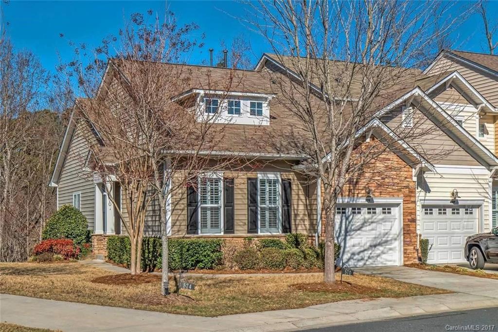 Immaculate, end unit, townhome on the Tega Cay Peninsula. Completely upgraded with touches of craftsman charm. Open floor plan with hardwood floors throughout main level. Fully updated kitchen & bathrooms, complete with granite counter tops. 3 bedrooms & 3 full baths, plus additional finished room on the lower level, potential 4th bedroom, study/office or bonus room! Master bedroom on main level. Outdoor entertaining space available on the extended, over sized deck overlooking the wooded lot.