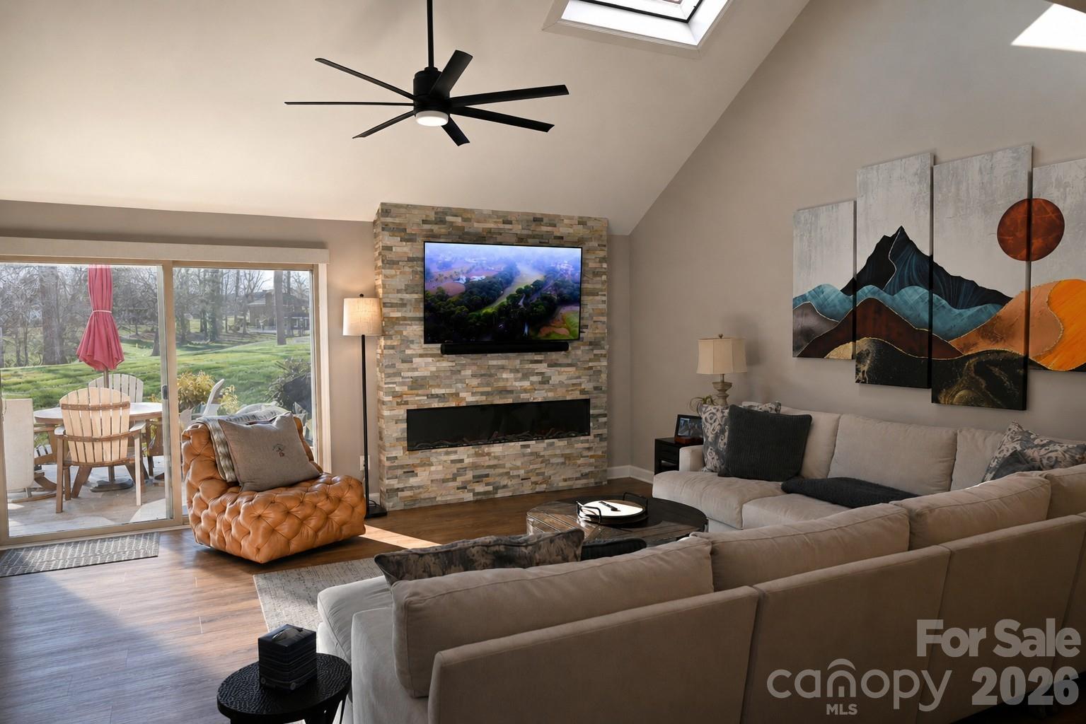 Impeccably renovated townhome overlooking the 11th hole of the renowned Tom Jackson Golf Course in the sought-after Rock Barn Golf and Spa community. Offering breathtaking golf course views, this beautiful home combines comfort, privacy, and elegance in a maintenance free setting. Step inside to an inviting floor plan filled with natural light, enhanced by soaring skylights, numerous windows, and a desirable southern exposure. Extensive renovations completed in 2022-2023 include new flooring and painting throughout, updated bathrooms, new plumbing and lighting fixtures, new faucets and toilets, new kitchen appliances and new HVAC and water heater installed in early 2023. A stylish wet bar and updated fireplace with new stonework was added to the living area, creating the perfect space for entertaining family and friends. The main level features a large kitchen with ample storage and counter space which is open to the dining and living areas. Just off the living room is a convenient half bath for guests and sunroom for additional entertaining. Best of all, the spacious primary bedroom is located on the main level with two walk in closets and spacious bathroom featuring dual vanities and large tiled shower and linen closet. The spacious laundry room is located just outside the primary bedroom for convienence. Upstairs, you'll find two generously sized guest bedrooms, one of which is an ensuite with beautifully tiled shower and walk in closet. There is an additional full bathroom on the upper level as well. A walk in attic on the upper level provides abundant storage space rarely found in townhomes. The attached two car garage offers additional storage and ample room for a golf cart, making it easy to enjoy the community's world-class amenities. The HOA covers exterior maintenance and lawn care, allowing you to spend more time enjoying the exceptional lifestyle Rock Barn has to offer, including 2 championship golf courses, tennis, pickleball, fitness facilities, indoor and outdoor pools, dining and more. Contact Rock Barn membership if interested. You do not have to join the club to live in this community..... but you will want to!