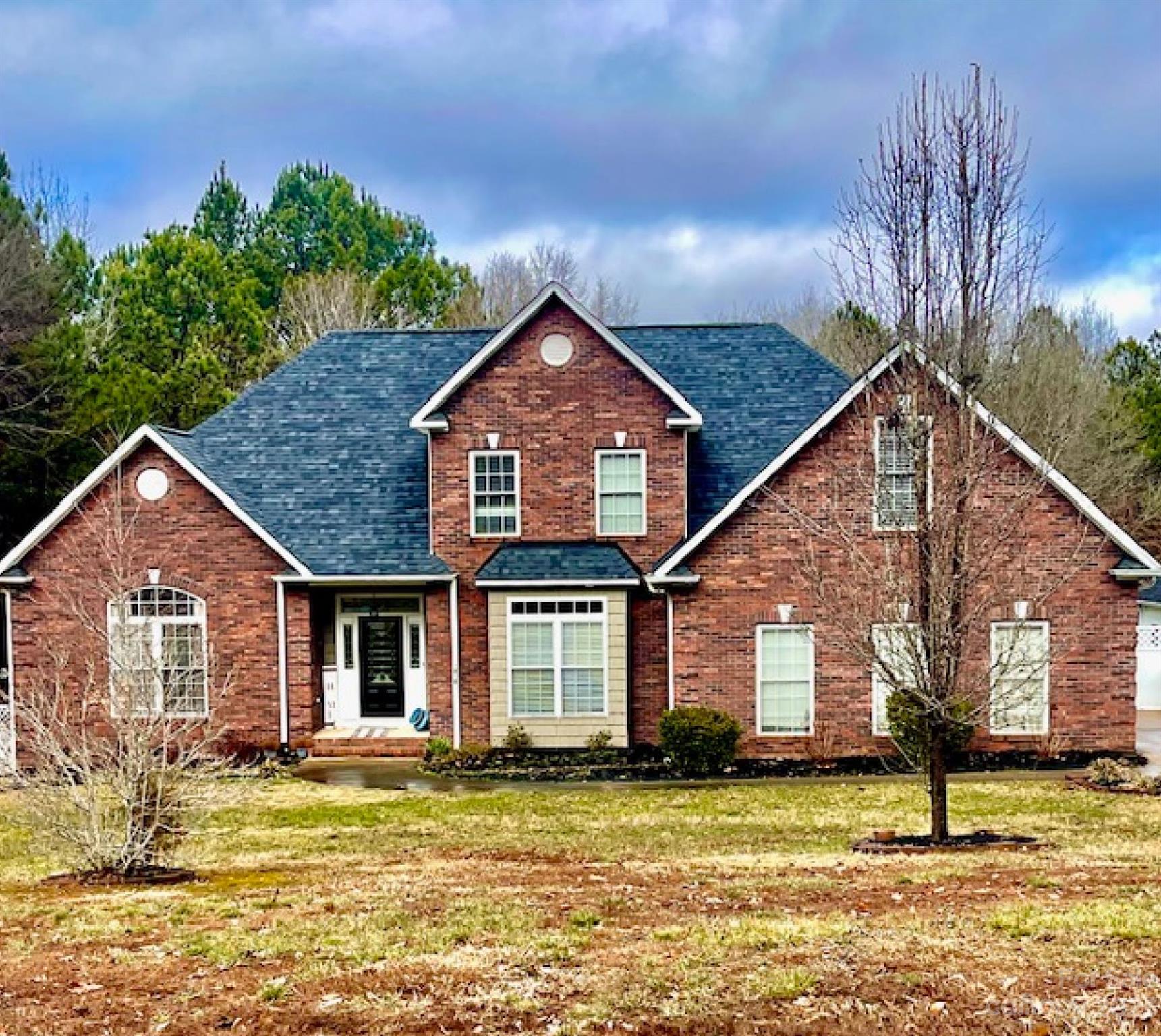 Welcome to this impressive two-story home in the Hunters Place community. As you enter, you are greeted with an open floor plan with a spacious living room with cathedral ceilings, a beautifully updated kitchen that was thoughtfully designed with black stainless appliances and a huge quartz island, a gas range with a pot filler, & ample cabinet space, a large pantry room, and a dining room. The primary bedroom (on the main level) provides a private retreat with its walk-in closet, shoe closet, and the updated en-suite bathroom with a two-person shower with gorgeous tile, heated floors and dual sink vanity. Have your morning coffee overlooking the backyard oasis from the sunroom or back deck. The sparkling in-ground pool, cabana, and pool house create the backyard that defines the art of outdoor living. The home has an attached two-car garage as well as a separate two-story garage/workshop with so much potential. The home sits on an acre of land in the award-winning Clover schools.