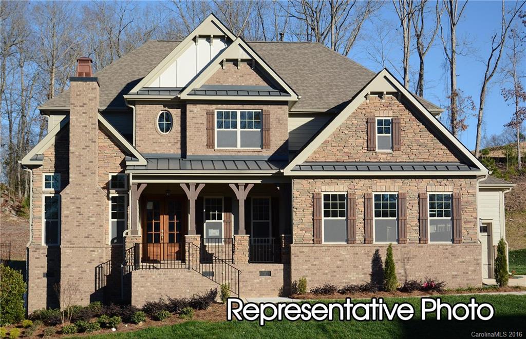 Location, Location, Location. Brick and stone home in prestigious Tega Cay loction, tucked away from it all, Stellar Fort Mill Schools, gourmet kitchen with high end appliances, hardwoods first floor, bedrooms will have upgraded carpets and pad, 3 car court yard garage, ceramic tile in all baths, beautiful molding throughout the first floor, home backs up to woods, this home is a must see with so much to offer. Minutes from I77, uptown Charlotte, Restaurants, shopping and more!