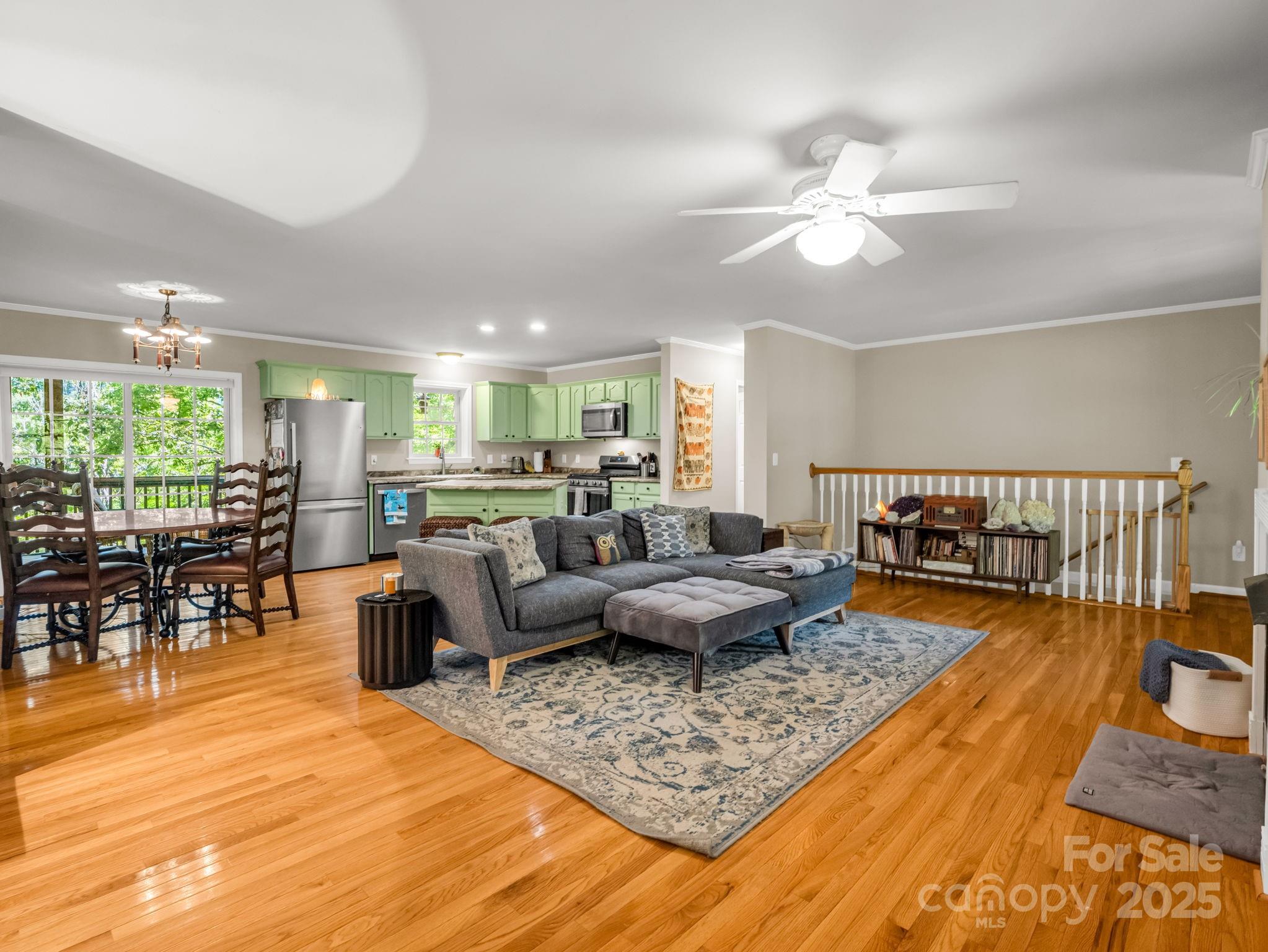 Beautiful lakefront retreat in the gated 3,000-acre community of Gateway Mountain. This spacious 4-bedroom home backs directly to Lake George and includes a private walking path to both the lake and a nearby waterfall. The main level features an open floor plan with wood floors, a fireplace, and a fully equipped kitchen with new appliances. A large screened-in deck and an expansive open deck overlook the nature preserve and Lake George—perfect for relaxing or entertaining.

The lower level offers generous flex space ideal for a home theater, office, recreation room, or additional guest space. The front yard includes a Pollinator Garden and three fruit trees (orange, nectarine, and peach).

Recent improvements include a brand-new metal roof and a new water pressure tank. Adjacent Lot 878 is included, offering potential long-range views and an excellent opportunity to build a second home or cabin for short-term vacation rentals.

Gateway Mountain provides easy access to Old Fort, Black Mountain, and Asheville—less than an hour away. This home sustained no damage from Helene and is truly move-in ready.

Seller is willing to include all furniture with an acceptable offer.