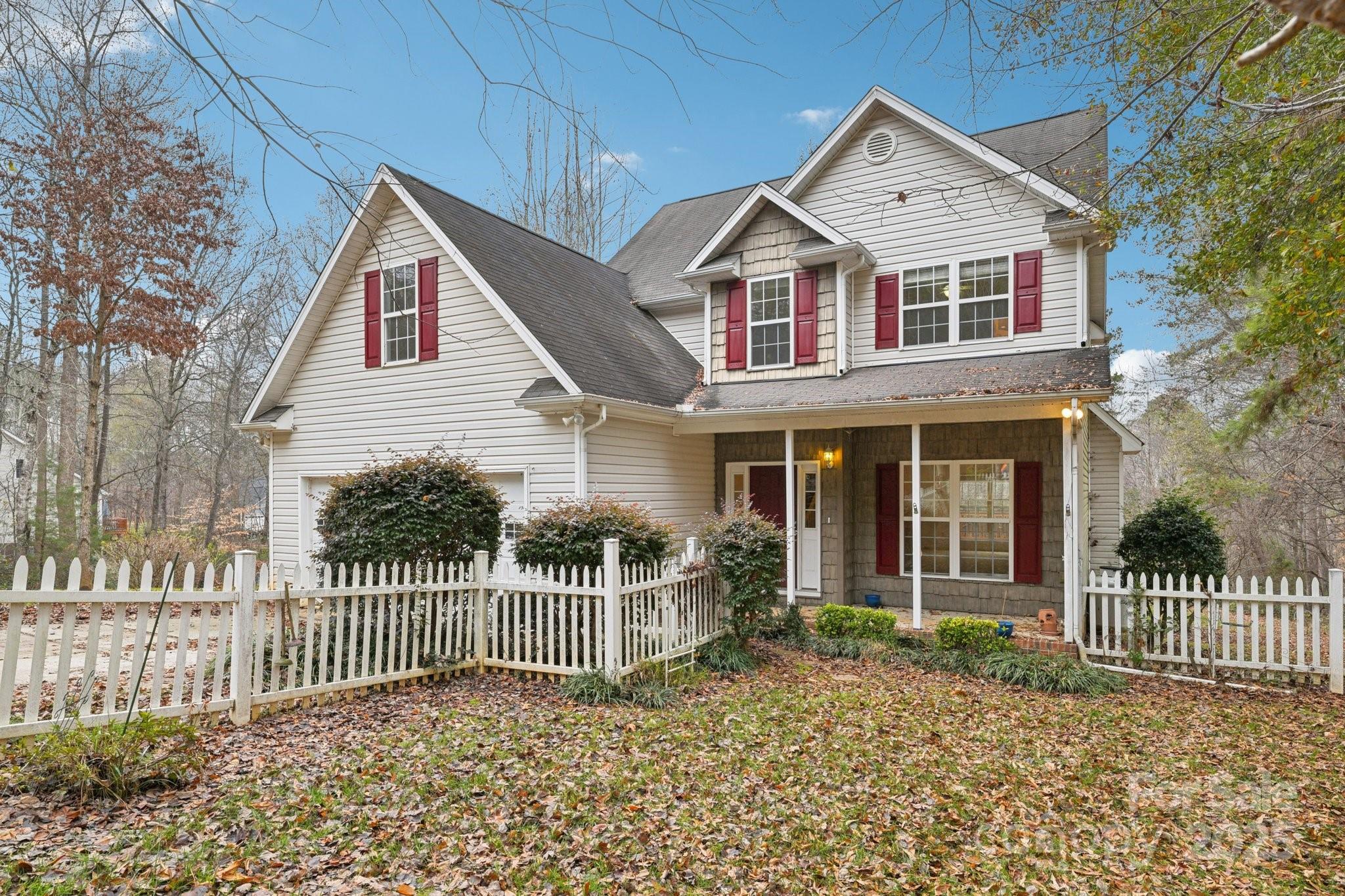 Lake Norman access for under $450,000! Welcome to this charming home in The Retreat, one of Sherrills Ford's most desirable Lake Norman Communities. Residents enjoy lake access, a community boat launch, and a community dock - perfect for embracing the lake lifestyle. Boatslips are available for $350 annually through a lottery system, and 5 slips are currently still available for this year. This property sits on nearly 3/4 of an acre, offering privacy and a peaceful wooded backdrop. A spacious rear deck provides the ideal outdoor setting for relaxing, grilling, or entertaining. Inside, the home has been freshly painted and features a warm and inviting gas fireplace in the living area. The dining room includes hardwood floors, adding a touch of elegance to everyday living. The primary suite offers its own ensuite bath, while a secondary bedroom is enhanced by an attached bonus room, giving you the flexibility for a home office, playroom, fitness area, or guest space. This home combines generous indoor and outdoor living spaces with lake access amenities and the peaceful setting The Retreat is known for, making it an excellent opportunity for anyone seeking the Lake Norman lifestyle.
