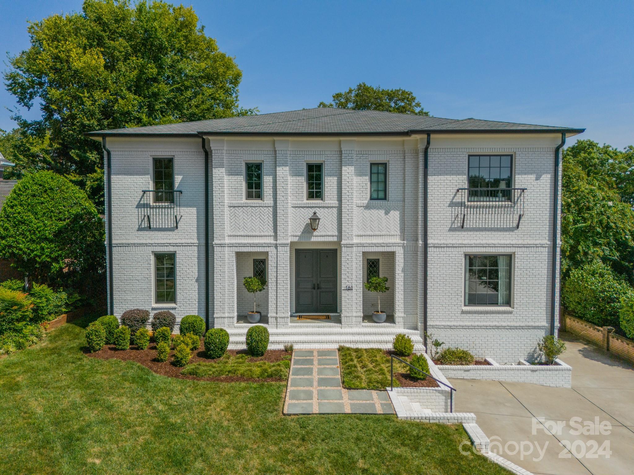 Beautiful, white brick home built in 2019 in stunning Eastover neighborhood features open floor plan, high ceilings, oak hardwood floors and custom interior finishes.  Gorgeous chef's kitchen with quart countertops, 48" Thermador range, 2 dishwashers, built-in nugget ice maker, beverage fridge, and huge walk-in pantry.  Main floor features a full guest suite.  2nd floor features primary bedroom suite with 3 additional bedrooms, office, and incredible laundry room.   Fully finished, carpeted, walk-out basement perfect for a theater room with additional exercise room and half bath.  Covered patio with wood burning fireplace.  Generator and turf backyard keep this home low maintenance.  Walkable to excellent restaurants, shops, and park and convenient to uptown.  Fantastic street and location!