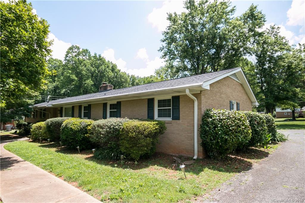 Lovely, well-maintained ranch home with 4 bdrms and 2 full baths. Spacious bedrooms, updated bathrooms, kitchen that opens up to the dining room and den, on over 1/2 acre level lot, large deck overlooks beautiful backyard. One of the few homes in the neighborhood with a GARAGE! Tons of parking w/ a 2 car garage with utility room, long driveway, and parking pad in the back. Garage is wheelchair accessible to the home. Sold As Is. The vacant lot next door is also listed for sale MLS# 3211146