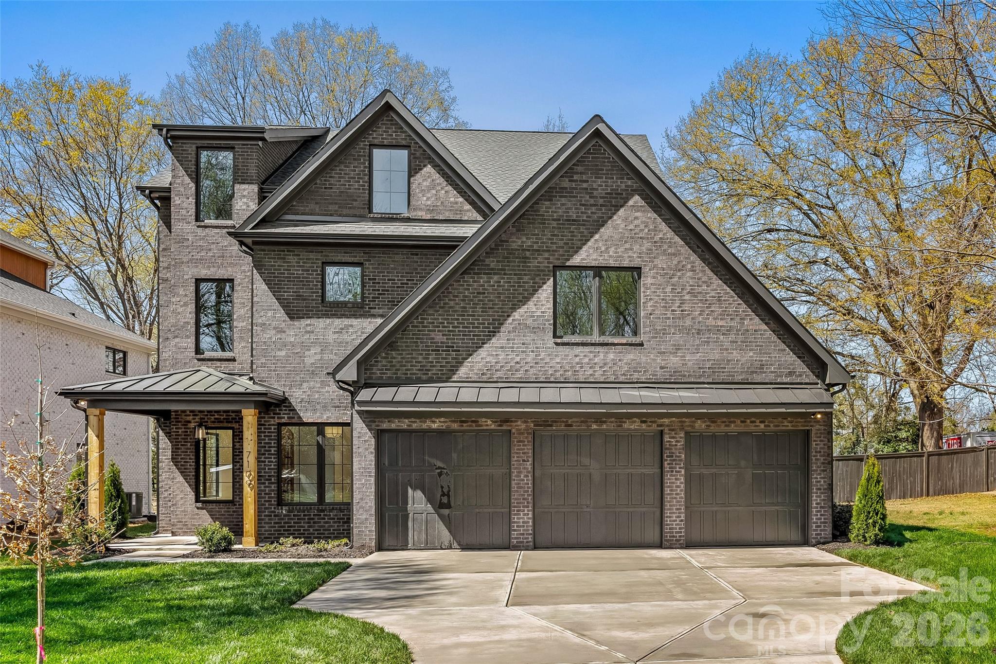 Welcome to this exceptional new construction home nestled on a quiet street in desirable South Charlotte, where thoughtful design meets modern luxury. This stunning three-story residence offers five spacious bedrooms and four-and-a-half beautifully appointed baths, providing ample space for both everyday living and entertaining.

Inside, the home features a classic formal dining room perfect for hosting gatherings, along with a private office ideal for working from home. The open and versatile floor plan also includes multiple flex spaces throughout the three levels, offering endless possibilities for a media room, playroom, fitness space, or guest retreat. Just off the kitchen, a generous walk-in pantry provides excellent storage and everyday convenience.

The expansive primary suite is a true showpiece, highlighted by a beautiful vaulted wood ceiling that adds warmth and architectural character. The spacious bedroom flows into a luxurious ensuite bath, and the primary bedroom itself features direct access to the laundry room for added everyday ease and functionality.

Step outside to enjoy the covered patio featuring a cozy gas fireplace—an ideal space for relaxing evenings or entertaining guests year-round.

Completing the home is a highly desirable three-car garage and the quality craftsmanship expected in new construction. With generous living spaces, flexible design, and high-end details throughout, this home offers the perfect combination of comfort, style, and convenience in one of South Charlotte’s most sought-after locations.