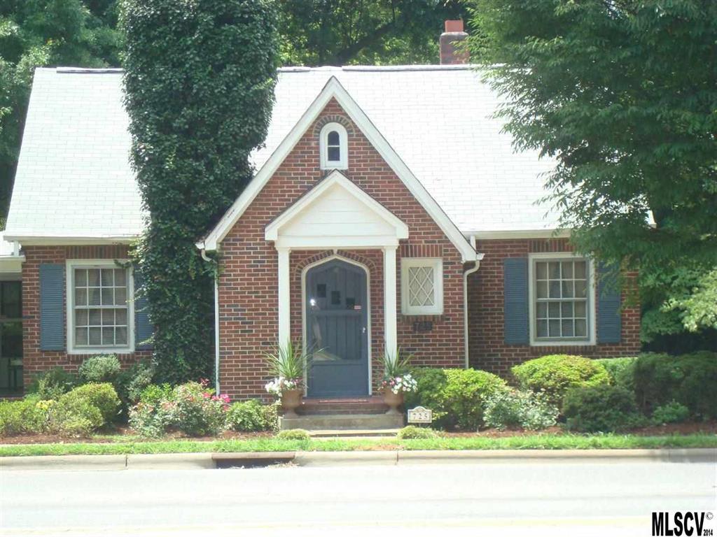 Charming & spacious! Walk to downtown, library, YMCA or Starbucks from this wonderful home! Lots of custom craftsman features throughout! Arched door opens into Foyer w/2 coat closets. Massive LR w/FP spans the entire width of the home - perfect for entertaining! LR opens to lovely side porch. Cozy Study/Keeping room joins the LR and the Kitchen. Charming Kitchen w/period touches & wonderful DR with 2 corner built-in china hutches. Sitting rm offers lots of windows & access to covered side porch. Main level MBR & lovely tiled bath w/marble counters & walk-in shower. Upper level offers 2 wonderful BR's with hdw floors & huge full bath, all w/lovely architecturally interesting ceilings. Lots of sought-after knotty pine wood throughout this lovely home. Owner says hdw floors under carpeted areas. Bright, sunny bsmt w/new linoleum flooring would make perfect craft or studio space. Laundry hookups on main & bsmt levels. Sec System. Double attached carport & deep lot complete this stunner!