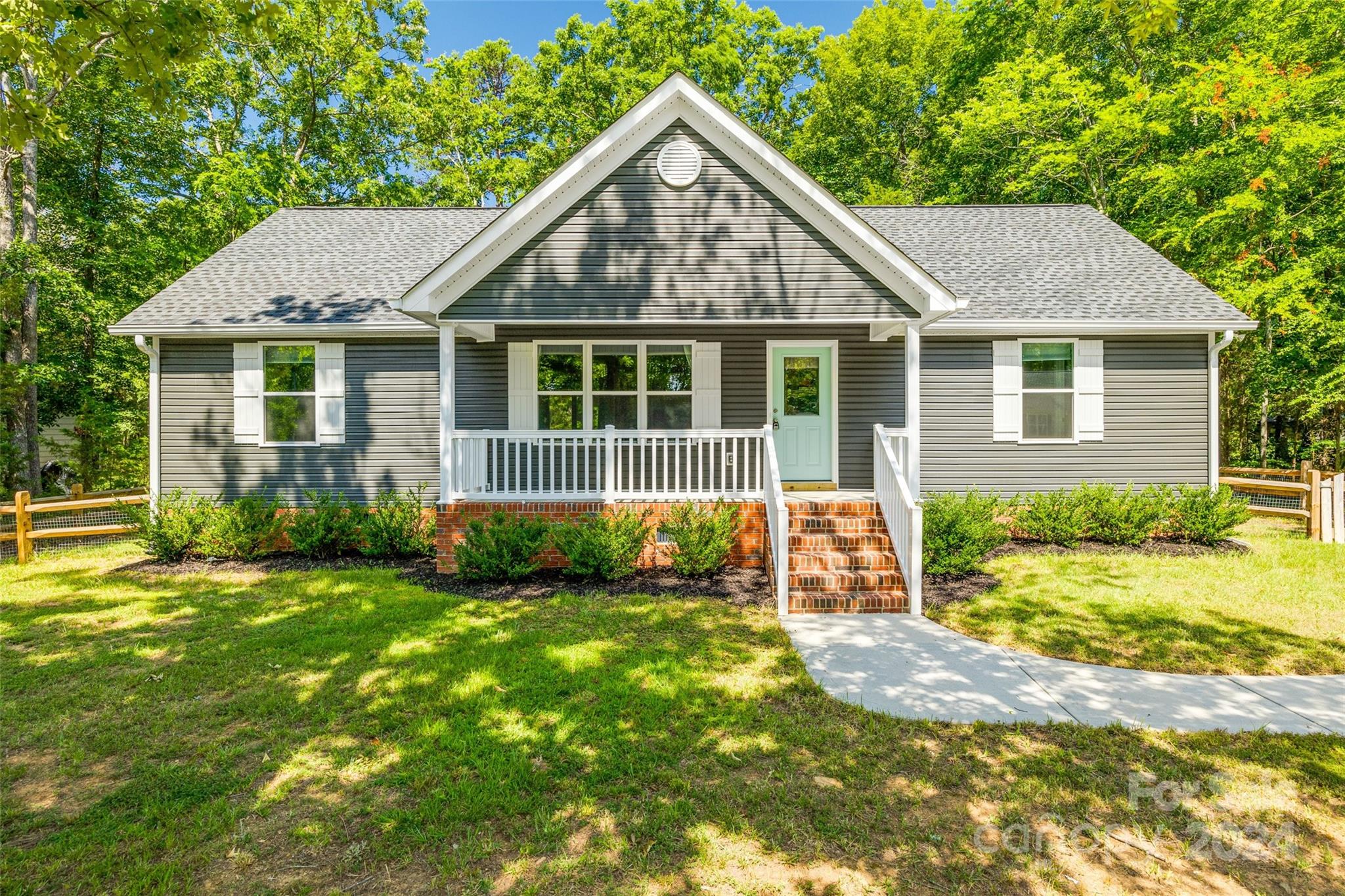 Welcome to 504 1/2 Putter Place, Chester SC! Don't waste any time to come see this beautiful 3-bedroom, 2-bathroom home that was just built in 2021! This home boasts an open floor plan, featuring LVP flooring in the main living areas, a vaulted ceiling in the main living area, and an abundance of natural light filling every corner, creating a warm and inviting atmosphere. The kitchen features sleek stainless appliances, nice cabinet space, and gorgeous granite countertops. Outside, you can relax on the oversized screened-in back porch or the charming front porch, perfect for enjoying your morning coffee or evening sunsets. This home is positioned perfectly between Richburg and Chester and only minutes from the Interstate! With its modern amenities and beautiful design, this home is a true gem. Don’t miss out on this fantastic opportunity—schedule your showing today and see for yourself all that this incredible home has to offer!