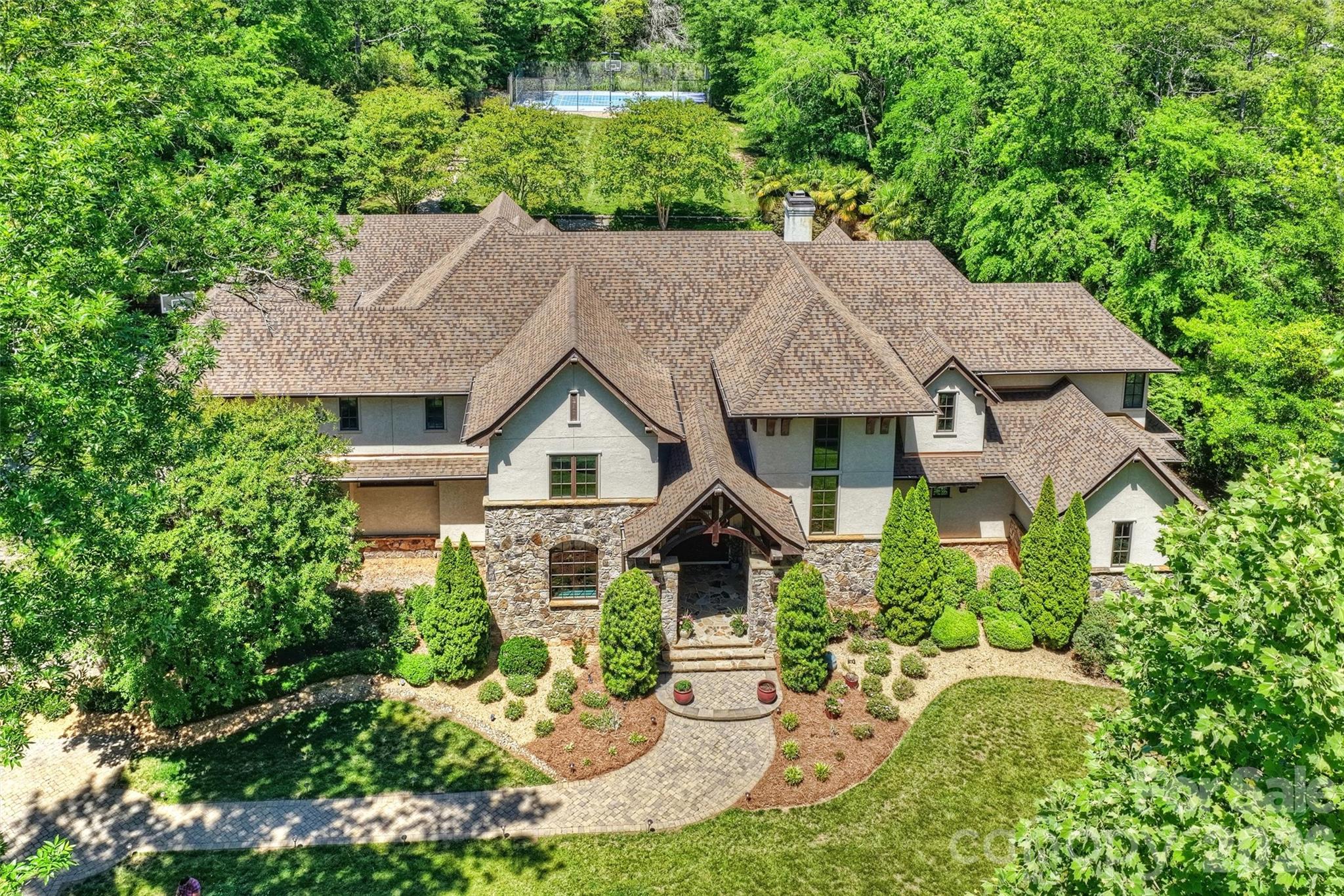 Tucked away with a cul-de-sac feel, this exceptional property is truly a must-see. Designed for both everyday comfort and unforgettable entertaining, the indoor and outdoor living spaces are unmatched. Step outside to enjoy your private swimming pool, sport court, putting green, a built in trampoline, and a covered outdoor patio complete with a grilling station--the perfect setting for gathering with family and friends.
Inside, the open floor plan offers effortless living with thoughtfully designed spaces throughout. New lighting shows off the kitchen and all rooms. Relax in the spacious living room featuring vaulted a ceiling and a stunning stone fireplace. Entertain with ease in the billiards room which includes theatre seating and a large Apple TV. The expansive kitchen with island flows seamlessly into the dining and living areas. See the features page attached. The large private study on the main level provides a workplace/ workout space with built-in bookcases. The primary suite overlooks the pool and backyard and includes a large spa-like bath and oversized wood paneled walk-in closet. A beautiful front entry welcomes all.The main level also features one full bath and three half baths for added convenience. Upstairs, you'll find four generously sized bedrooms, four full baths, and a large bonus room offering flexible space for recreation, media or fitness. The crawl space has a concrete floor you can stand up in and it is finished. Roof completely replaced in 2025 with 30 year shingles and copper gutters. Fully fenced with double fencing at gates keeps pets safe! Two double garages with storage closets in both and an EV charging station.