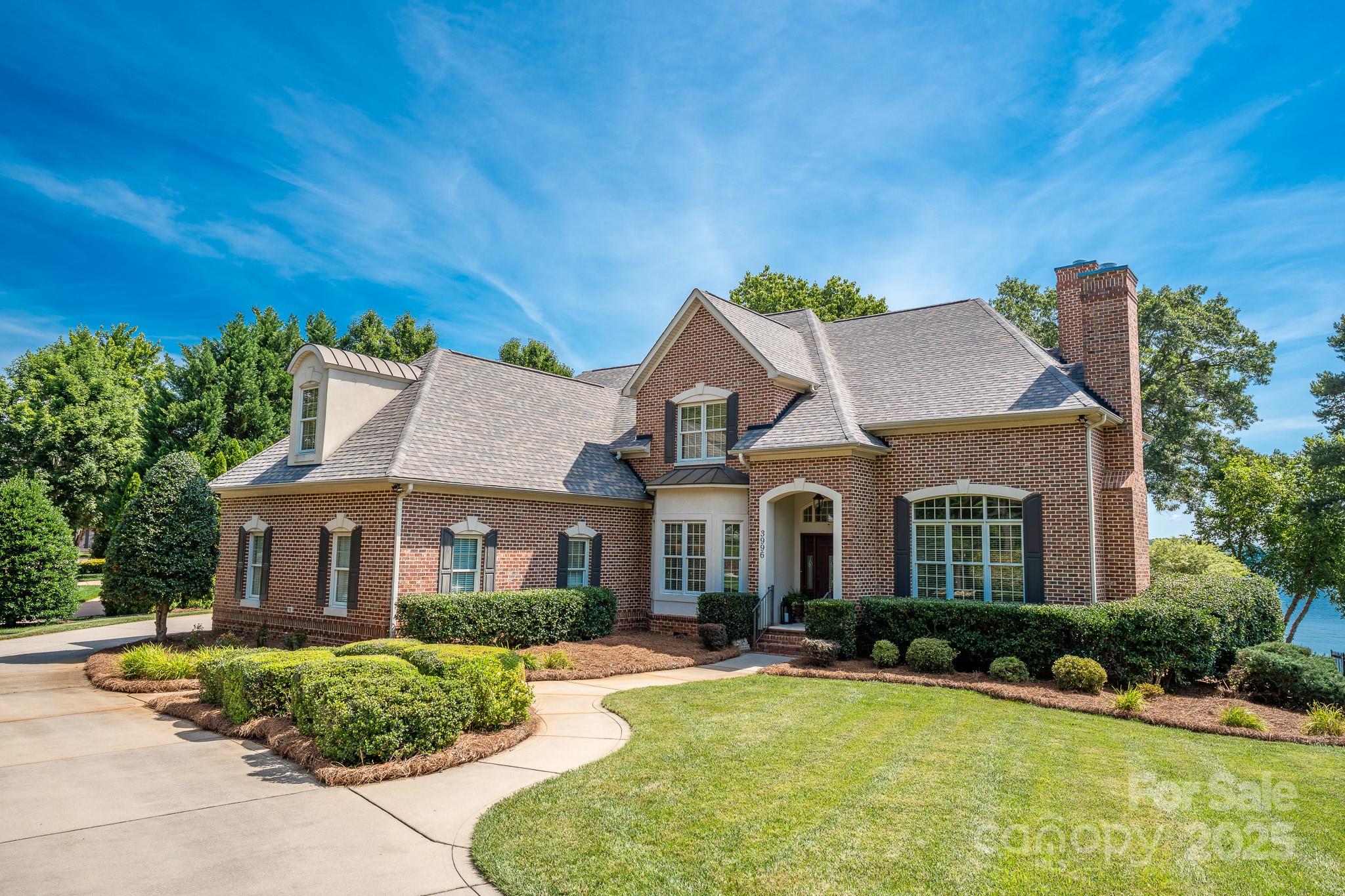 Welcome to Channel Point Ln, the pinnacle of Lake Norman living!
This immaculate custom home is nestled on a quiet cul-de-sac within the Sailview Community. Step inside and discover breathtaking main channel views from nearly every room. The main floor offers a gorgeous primary suite with recently updated wood floors, an open living room, and a dedicated office, all complemented by two custom fireplaces. The beautifully updated kitchen is a chef's delight, featuring top-of-the-line appliances. Upstairs, you'll find three additional bedrooms and an oversized flex room complete with a full wet bar, perfect for entertaining. A long, hidden driveway leads to a convenient side-load three-car garage. The updated stationary dock boasts trex decking, jet ski floating docks, and a covered seating area, ideal for enjoying the lakeside lifestyle. This is lake living at its finest! Don't miss the opportunity to own this wide-water gem, just in time to enjoy the summer on beautiful Lake Norman!