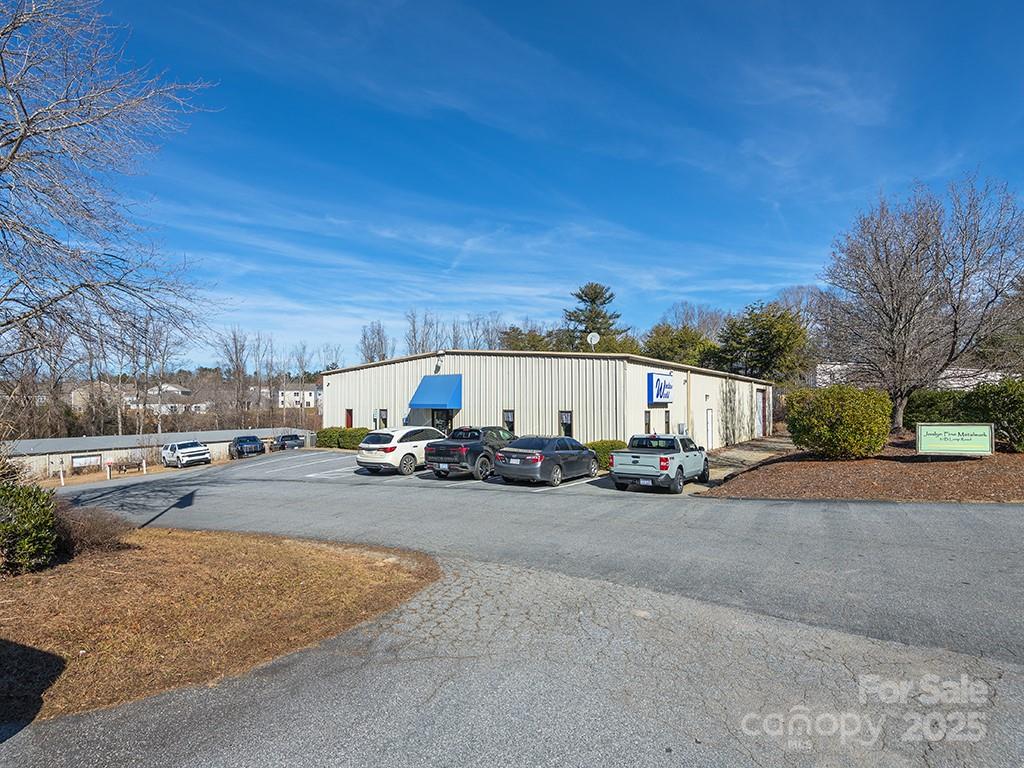 Rare opportunity to own a fully-leased, multi-tenant flex property in Arden. 

Consists of 2 buildings, 5 units, and 17,520 SF on 1 parcel. 

Located off Airport Road, property provides easy access to I-26, Asheville Airport, Downtown AVL, and Downtown HVL. Airport Road offers every amenity, EMP zoning allows most commercial uses.

35 Loop Road is 6,320 SF (per County records) and offers loading dock, drive-in door, office, and warehouse space. Leased to Window World through July 2025. 

37 Loop Road is 11,200 SF (per County records) divided into 4, 2,800-SF units. Each offers office, warehouse, bathroom, and drive-in door. Leased to 3 tenants; Kitchen & Granite, Joslyn Fine Metalwork, and Rennwerx European Automotive Repair (2 units). Leased thru mid-2025. 

Leases average $9.20 per SF, modified gross. MG leases and capital improvements allow owner to add value. 

This prime flex property presents a solid investment and potential for growth in a high-demand market.