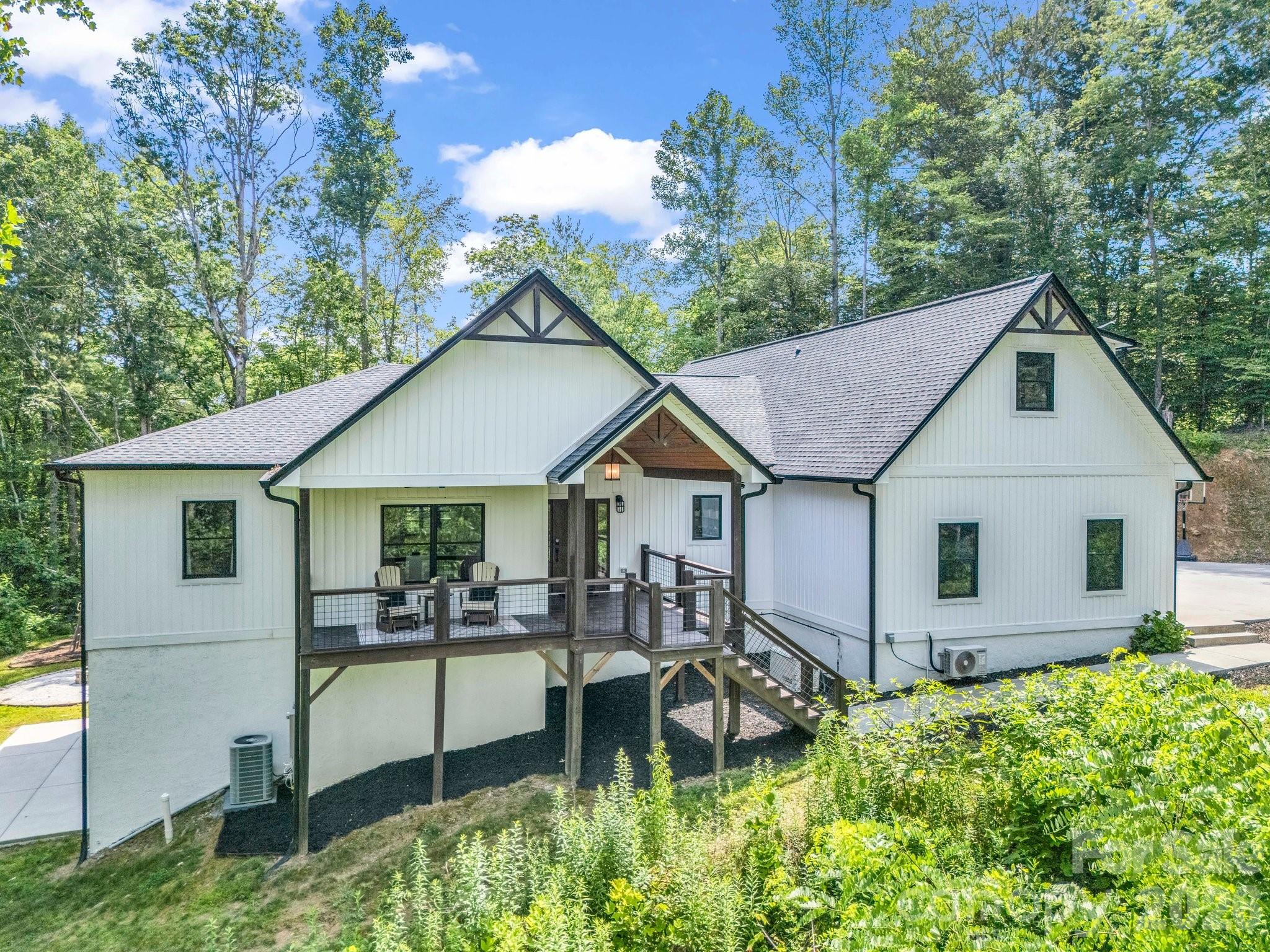 Public Remarks 
Nestled on 6 private acres along the side of the mountain in scenic Horse Shoe, this beautifully built home offers the perfect blend of comfort, functionality, and breathtaking natural surroundings. With 4 spacious bedrooms, 4 full bathrooms, and a dedicated office, there's room for both work and relaxation. The main level features an inviting living room, while the lower level offers a second living space great for entertaining guests. A charming bonus playroom with its own full bath on the upper level adds flexible space for recreation or hobbies. A three-car garage provides ample parking and storage, and a well-equipped workshop located directly beneath the home is a dream for makers, hobbyists, or professionals. Enjoy the peace and privacy of mountain living with the convenience of thoughtful design and quality craftsmanship throughout.