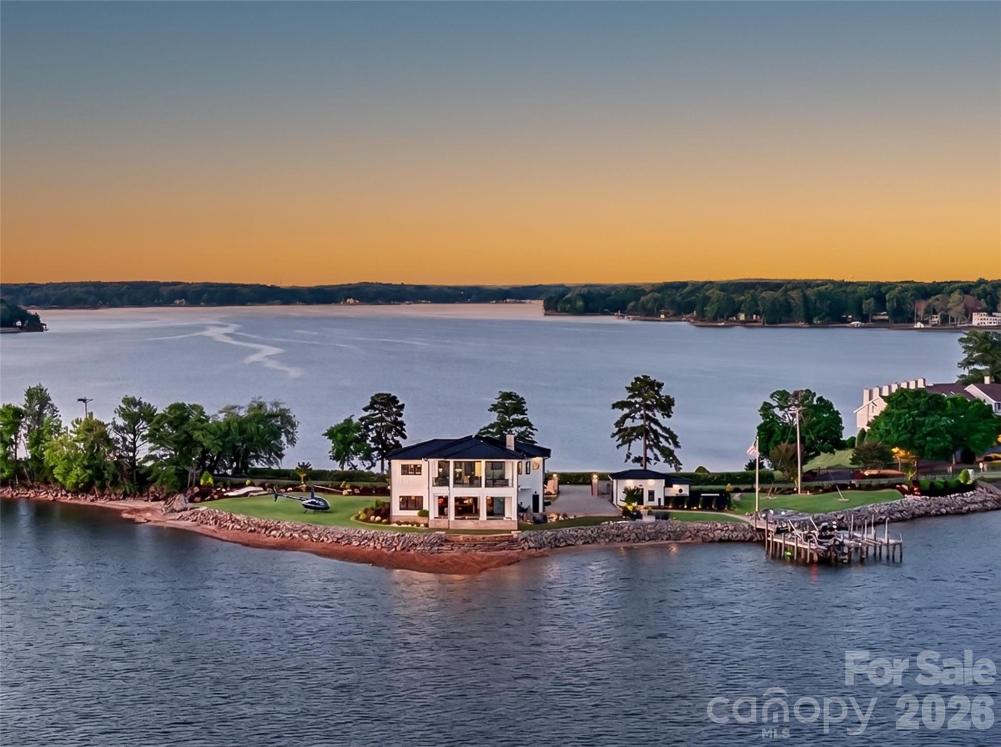 Welcome to Vista del Sol — an extraordinary three time Award Winning Design waterfront retreat. This amazing home redefines luxury living on Lake Norman.  Offered at $7.7M, this architectural showpiece captures uninterrupted panoramic water views from nearly every vantage point, creating a breathtaking backdrop for everyday living AND provides an area for a Helicopter pad.

Privately tucked away on Kiser Island peninsula, this exclusive estate blends refined sophistication with the tranquility of a true lakefront escape. The grand two-story residence showcases exceptional craftsmanship throughout, paired with meticulously manicured grounds designed to elevate both indoor and outdoor living.

Featuring 4 spacious bedrooms, this home was thoughtfully designed for luxurious comfort and effortless entertaining. Lounge beside the resort-style pool as shimmering lake views stretch endlessly beyond, or enjoy sunset evenings from your private dock or upper level semi enclosed balcony in one of Lake Norman’s most sought-after waterfront settings.  

With unmatched privacy, captivating views, and timeless elegance woven into every detail, Vista del Sol offers a rare opportunity to experience the pinnacle of Lake Norman's waterfront luxury living.