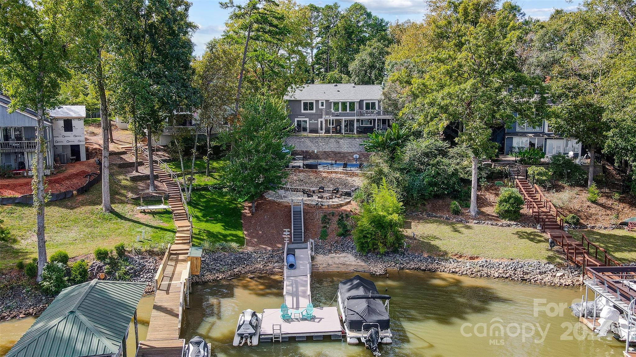 Stunning, Fully Renovated Waterfront Home with Pool & Entertaining Space!  
This beautifully renovated 4-bedroom, 3.5-bath home in the sought-after Tega Cay community is move-in ready with modern updates throughout. 

The main floor features a primary bedroom with en-suite bath, and lake views. The open floor plan includes a living room and a kitchen with sleek countertops & stylish cabinetry. Each bathroom has been freshly remodeled for a contemporary feel.

Downstairs, you'll find a large family room & game room, perfect for gatherings with an added half bath, plus another primary bedroom with its own custom closet and bath with stunning lake views.

Outside, relax by the pool, enjoy the firepit, or head out from your private dock for a day on the lake. Perfect for entertaining or unwinding under the stars.

Schedule your showing today!