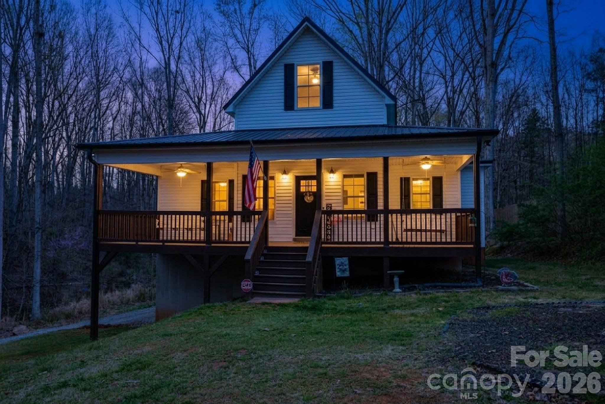 COUNTRY LIVING WITH MODERN COMFORT!  LIKE NEW!  NO HOA!
Experience the perfect blend of privacy, charm, and convenience in this beautifully maintained, like-new 2019 home on over 1.5 acres and just minutes from historic downtown York. Nestled among mature trees with a peaceful creek and natural surroundings, this property offers a serene, mountain-like setting with room to breathe.

Relax on the expansive full-width front porch and take in the sights and sounds of nature, or enjoy your morning coffee from the private balcony off the spacious primary suite. Inside, you’ll find an open, light-filled floor plan with durable, stylish flooring throughout—no carpet anywhere.

The kitchen is designed for both everyday living and entertaining, featuring granite countertops, farmhouse sink, a large center island, and an oversized walk-in pantry. The primary suite overlooks the backyard and includes two walk-in closets, a private water closet, and convenient access to a large pull-down attic for additional storage.

The full basement is already plumbed for a bathroom and offers endless potential—possibly a second living space, guest quarters, or multi-generational living.The expansive drive-under garage provides exceptional functionality, with ample space to accommodate a full-size truck, ATVs, lawn equipment, and even a workshop setup. 

With neutral finishes, thoughtful design, and meticulous care throughout, this move-in ready home delivers the feel of new construction without the wait—all in a peaceful, no-HOA setting.