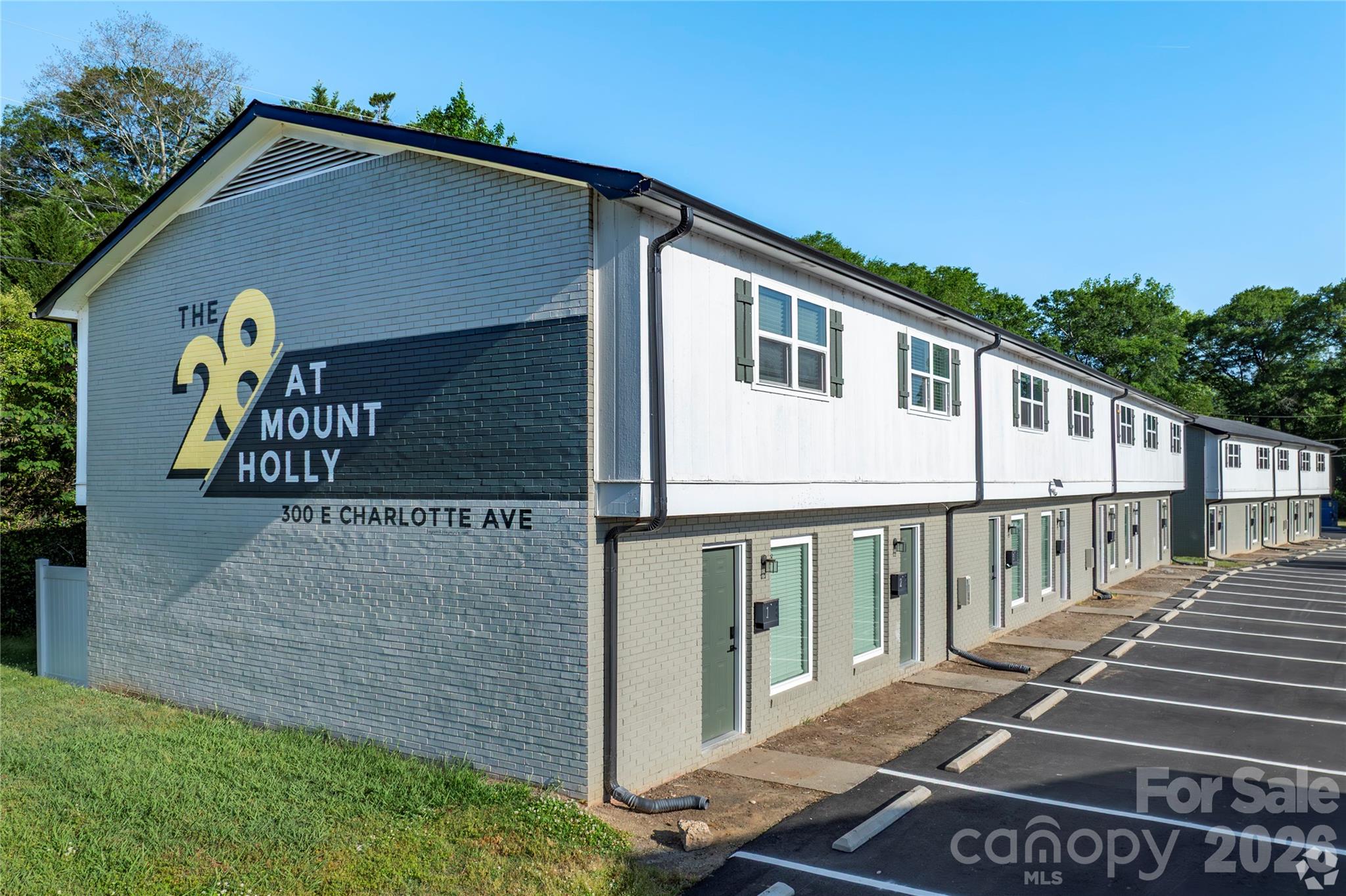 THE PROPERTY - The 28 at Mount Holly is a 28-unit townhome community situated one block from downtown Mount Holly, NC — approximately 20 minutes from Uptown Charlotte. Every unit is a two-bedroom, one-and-a-half bathroom townhome averaging 1,000 square feet, featuring in-unit washer/dryer hookups, private patios, and fully renovated interiors. Following a comprehensive $1.4M renovation completed in 2025, the Property offers investors a turn-key, low-maintenance multifamily asset in one of the Charlotte MSA's most accessible suburban markets.

$1.4M IN RECENT CAPITAL IMPROVEMENTS - A property-wide renovation completed in 2025 addressed every major component— exterior and interior — with no near-term capital requirements for a new owner. Improvements include: New parking lot overlay, exterior paint, gutters & downspouts, full HVAC replacement across all units, new windows, sliding glass doors, and smart lock front doors. Add'l Interior upgrades: new cabinets and shelving, granite countertops and backsplash, luxury vinyl plank flooring, and stainless steel appliances. The property also has recently implemented individual water/sewer sub-metering, eliminating a significant landlord expense, and a bundled cable & internet package, generating incremental NOI while offering a convenient service.

PROVEN RENT GROWTH WITH REMAINING UPSIDE - The seller's post-renovation lease-up strategy has produced a current averagein-place rent of $1,314/month, with rents ranging from $1,275 to $1,440 across the property. The $165 spread between the lowest and highest in-place rents— achieved within the same renovated unit type — demonstrates clear market acceptance at the top of the range. A new owner has a straightforward path to capture loss-to-lease as below-market leases roll, with no speculative assumptions required.
MAIN & MAIN LOCATION - The Property sits one block from the heart of downtown Mount Holly — home torestaurants, coffee shops, breweries, and the Carolinas' oldest legal distillery. Convenient access to I-485 connects residents to Uptown Charlotte, Gastonia, and major employment corridors throughout the MSA. Notably, the Olde Mecklenburg Brewery is opening a Beer Garden and Tap Room in downtown Mount Holly in Fall 2026, with planned mixed-use development and an extensive renovation of Veterans Park further cementing the area's trajectory as a destination submarket. 

The Property is located within a FEMA-designated flood zone and was impacted by Hurricane Helene in 2024. Ownership undertook landscaping remediation to reducefuture exposure, and the Property carries flood insurance. Buyers should review applicable flood zone designations as part of their due diligence.