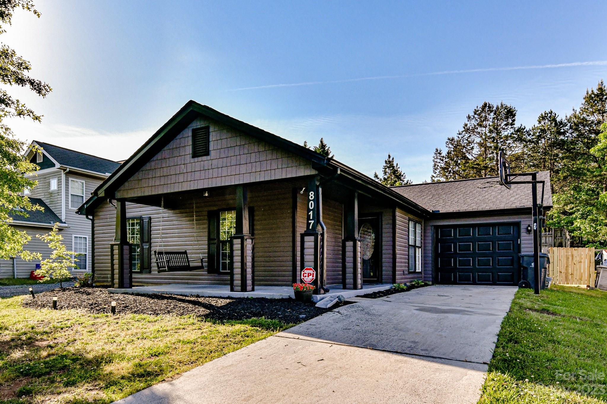 Welcome to this 3 bedroom, 2 bathroom home on a private, cul-de-sac lot! Charming rocking chair front porch greets you to the front door. Fresh paint, LVP flooring & updated light fixtures throughout. Open living room, dining area & kitchen is perfect for entertaining! Kitchen features granite countertops, tile backsplash & stainless steel appliances. Living room adorned with vaulted ceiling, fan & gas fireplace. Primary bedroom with tray ceiling, fan & dual closets. Secondary bedroom boasts large walk-in closet. Sizeable laundry room. Sliding door from dining area leads to spacious deck with seating & backyard with privacy fence. Such a great spot to relax! Roof 2022. Attached 1 car garage. Close to shops and restaurants in Riverbend Village & easy access to Brookshire Blvd & I-485.
