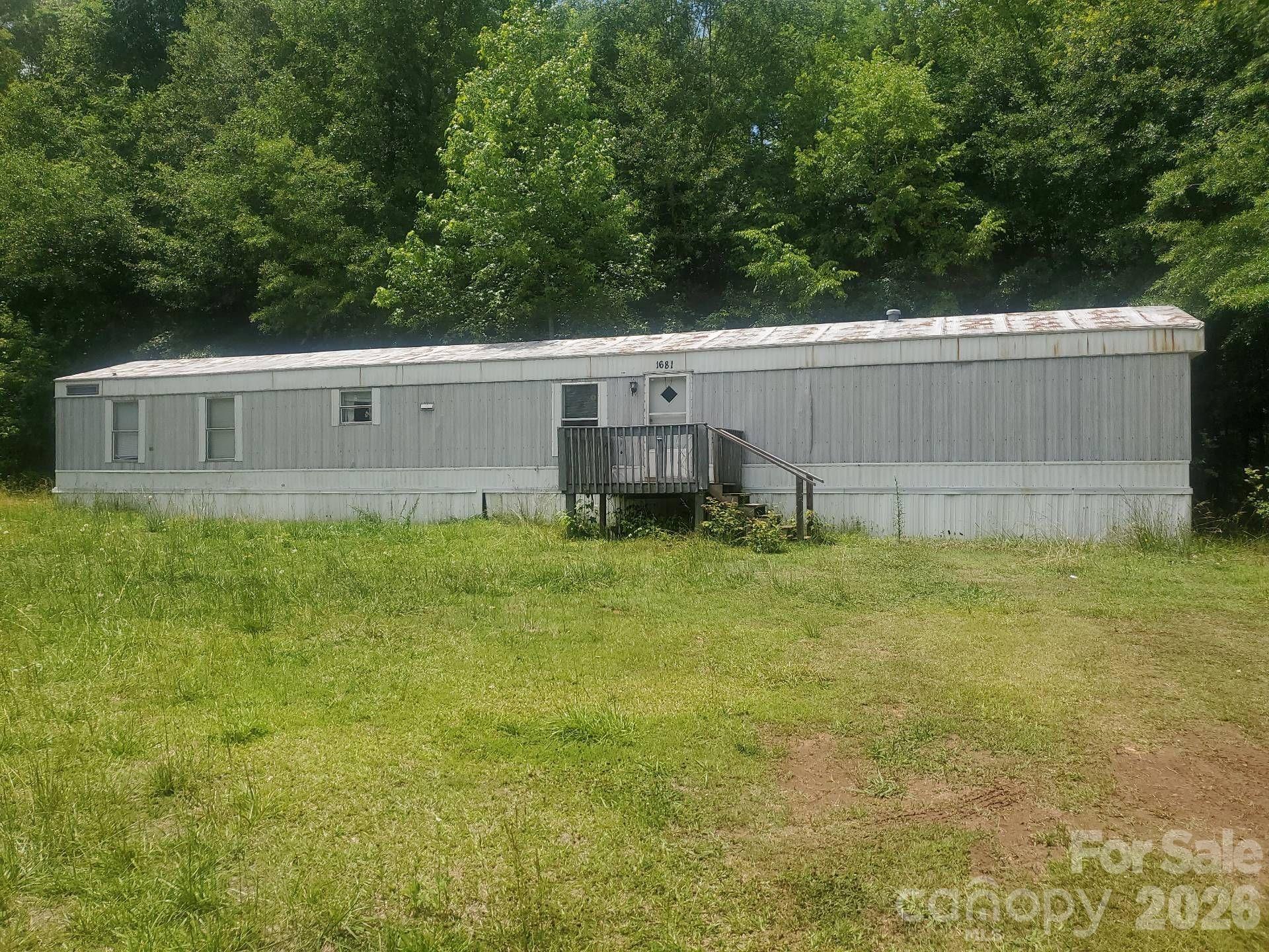 17.87 acres with approximately 8 acres in a flood plan. Includes 1170 square foot single wide.